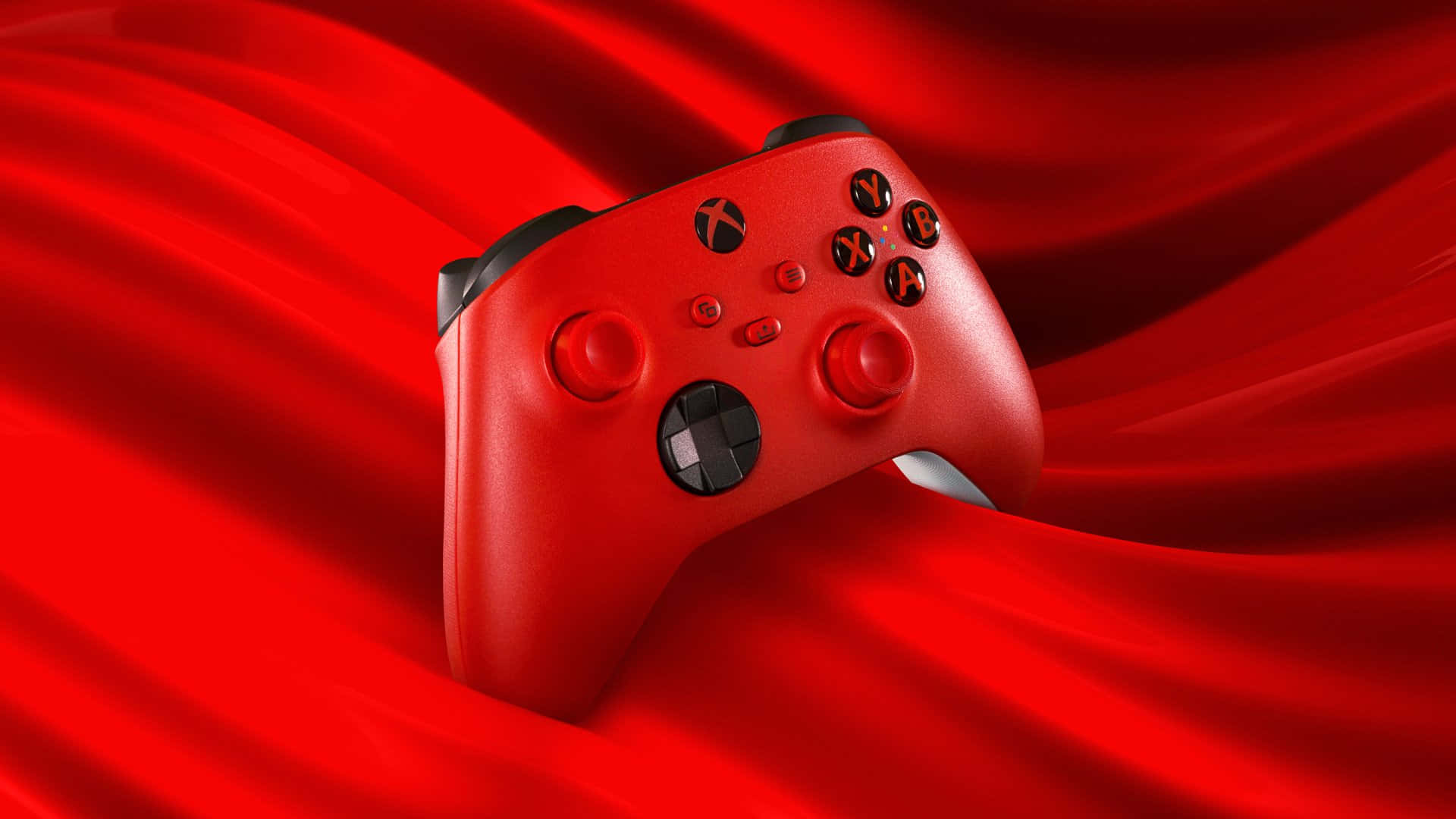 紅色Xbox控制器在流動的紅色布料背景上