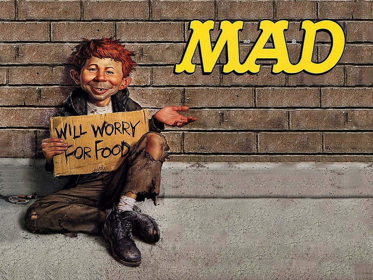 卡通男孩在磚牆上的MAD標誌附近手持「Will Worry For Food」標語牌。