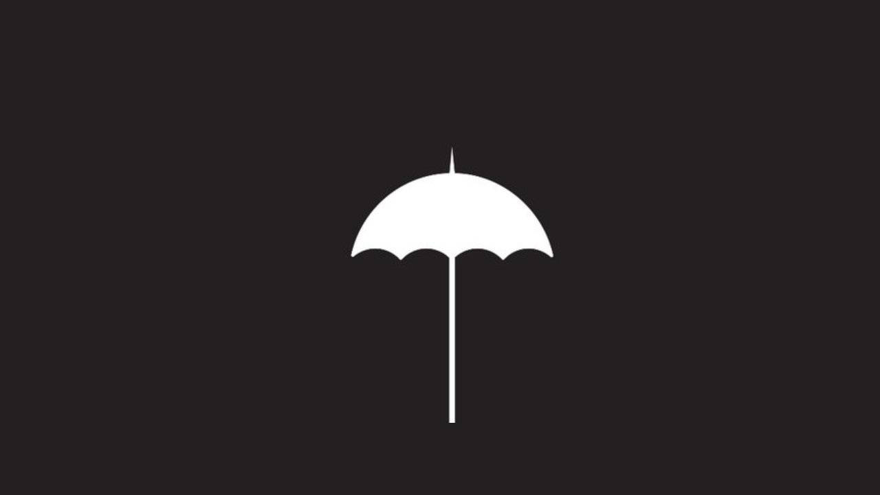 黑色背景上的白色雨傘圖標