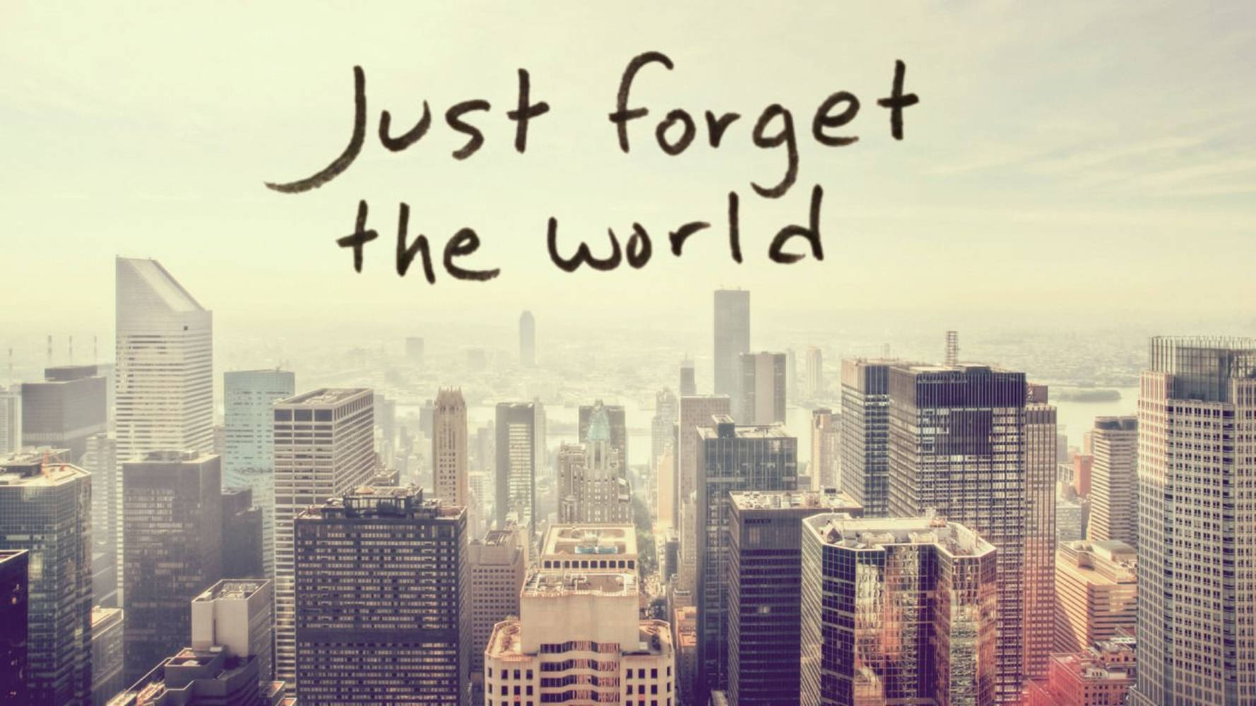 城市天際線，帶有文字疊加，顯示「Just forget the world」