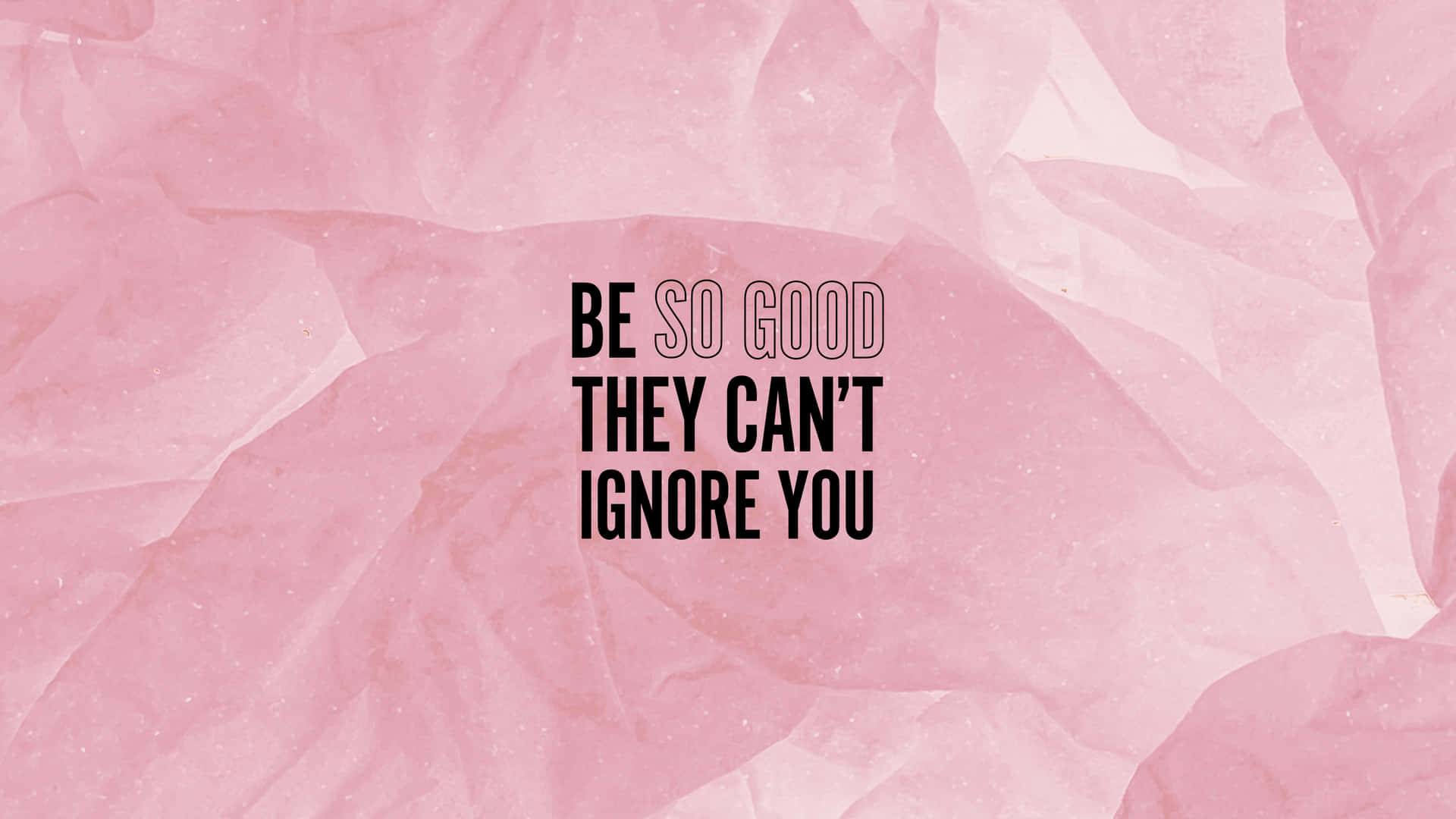 勵志名言「be so good they can't ignore you」在粉紅色皺紙背景上