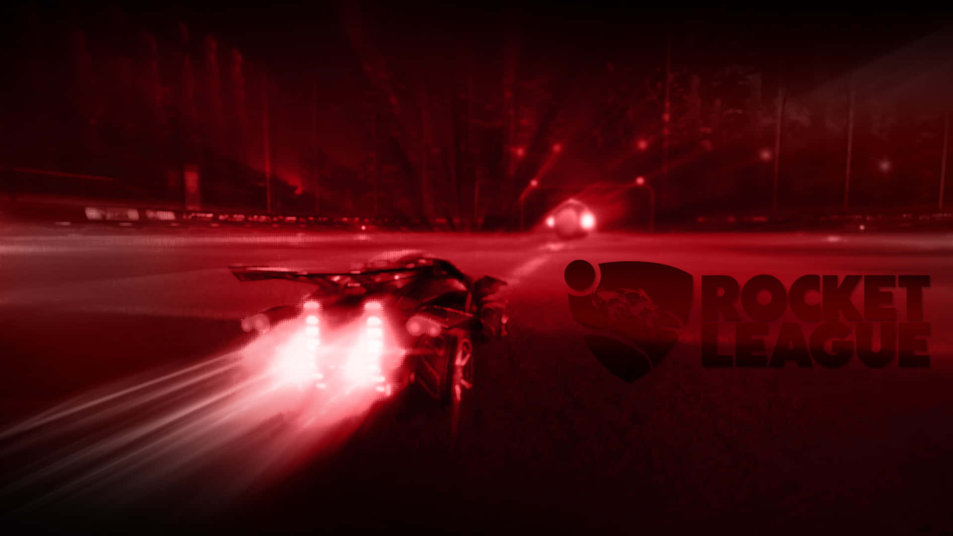 擁抱極致的戰車競技運動 —— Rocket League 壁紙 — 一輛紅色燈光的火箭動力汽車在黑暗的競技場中疾馳，帶有動態模糊和發光的排氣軌跡。