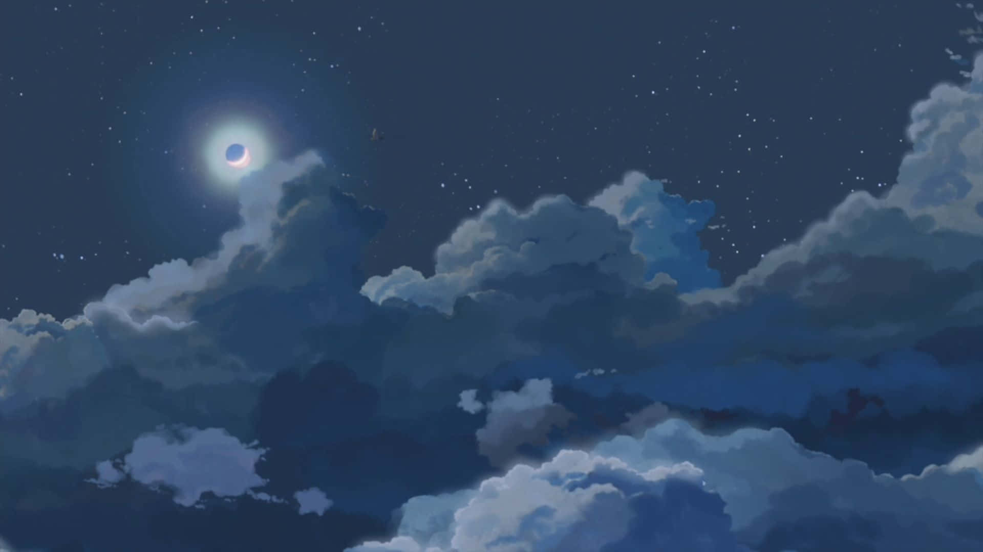 新月在繁星夜空中的雲層後