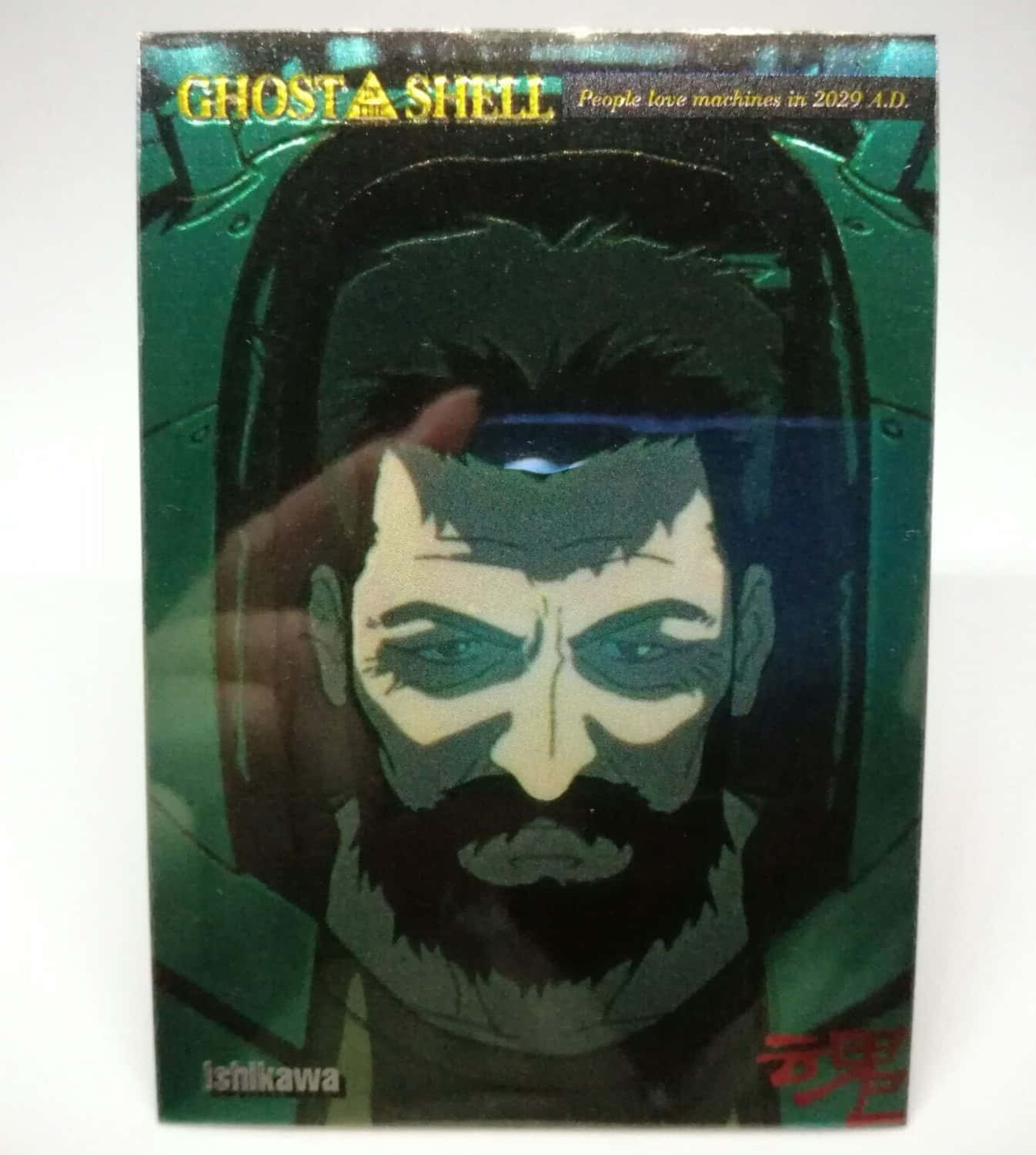 Ghost In The Shell Ishikawa 桌布 壁紙 — 《攻殼機動隊》中戴著綠色和黑色色調的賽博格頭盔的鬍鬚男子的特寫。
