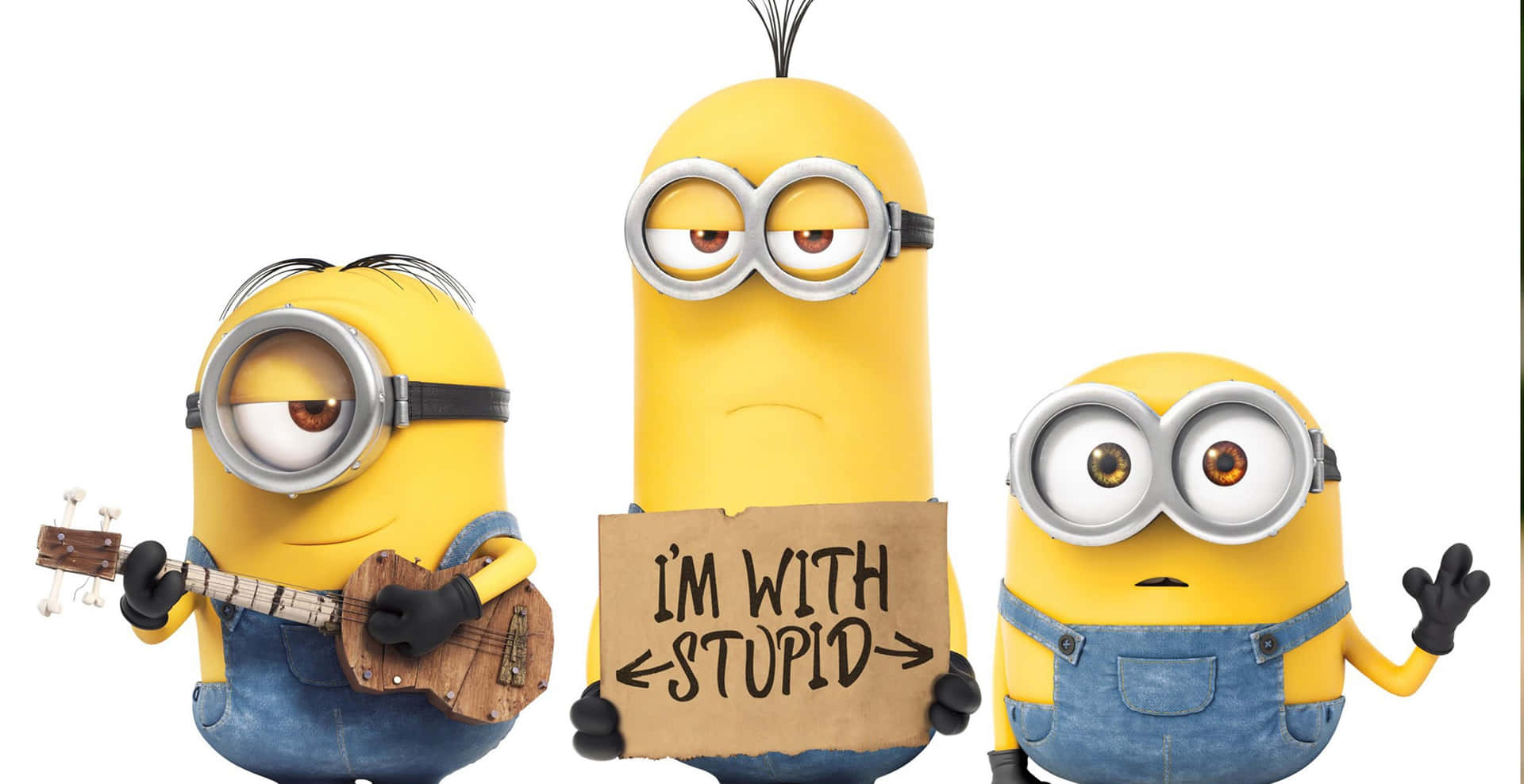 三個Minions，一個彈奏烏克麗麗，一個舉著寫有I'M WITH STUPID的牌子，一個揮手。
