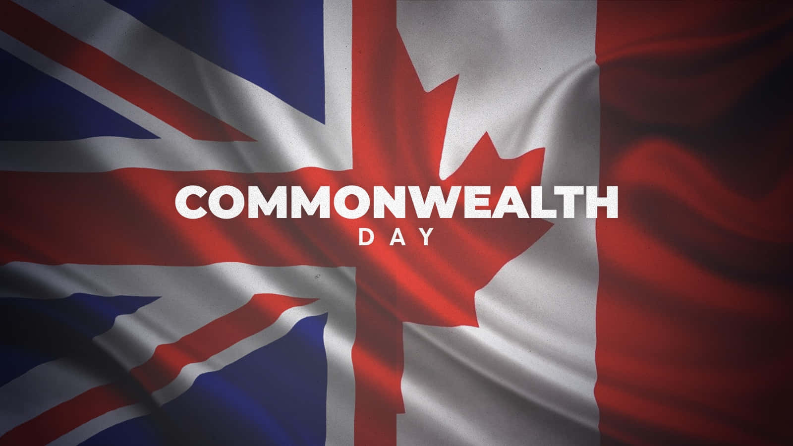 Commonwealth Day 桌布 壁紙 — 數碼渲染的旗幟，融合英國國旗和加拿大楓葉，並以粗體白色文字寫著 Commonwealth Day。