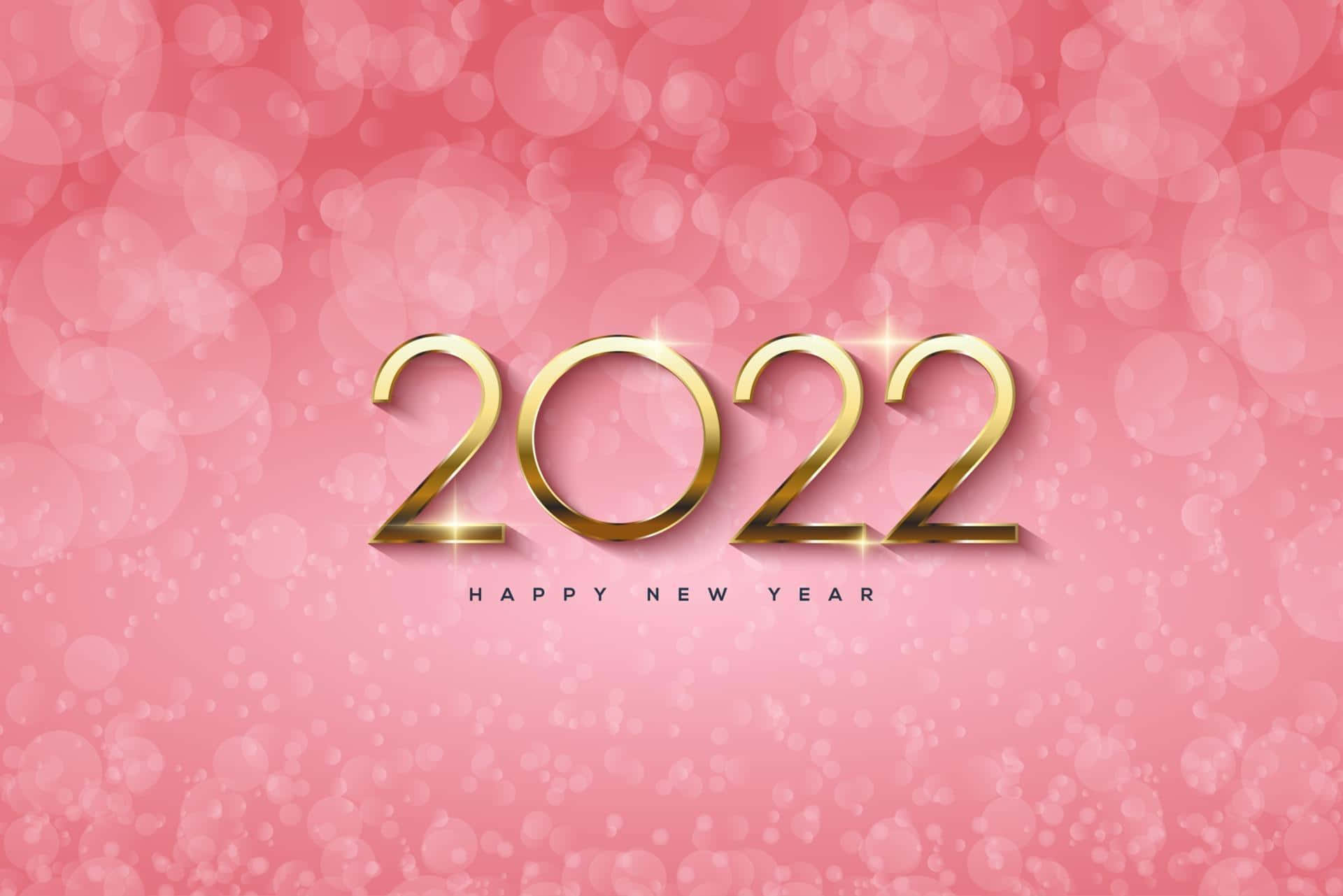 金色2022字樣在粉紅色散景背景上閃爍，用於新年慶祝。