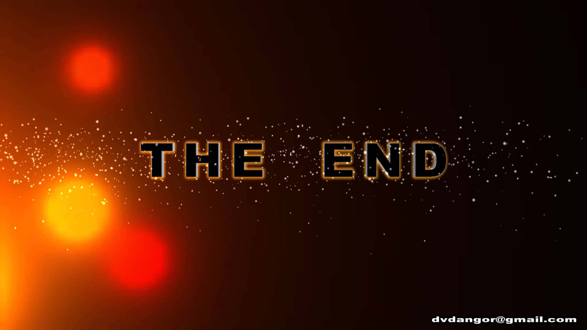 帶有發光橙色燈光和閃爍粒子的The End標題卡。