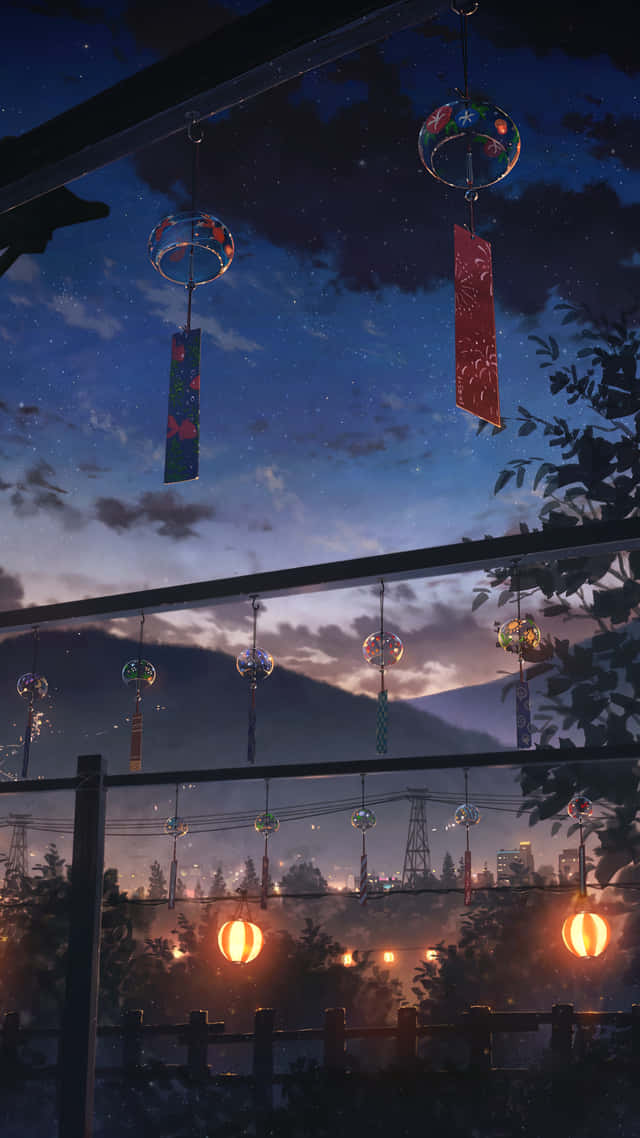 風鈴和燈籠在城市上空的繁星夜空下閃耀。 — 動漫城市 壁紙