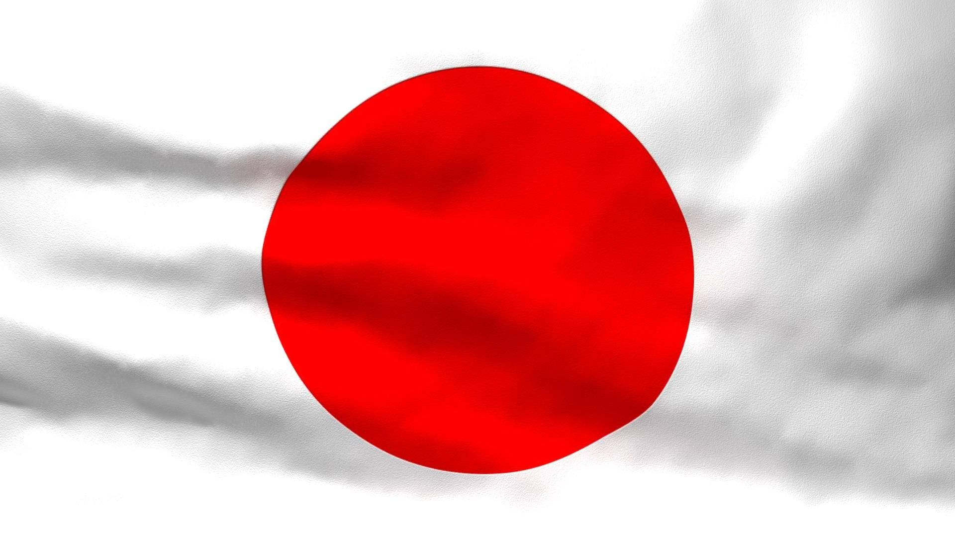 日本國旗印於皺紙上 壁紙 — 一個鮮紅色的圓圈位於白色布料旗幟中央，在風中動態飄揚。