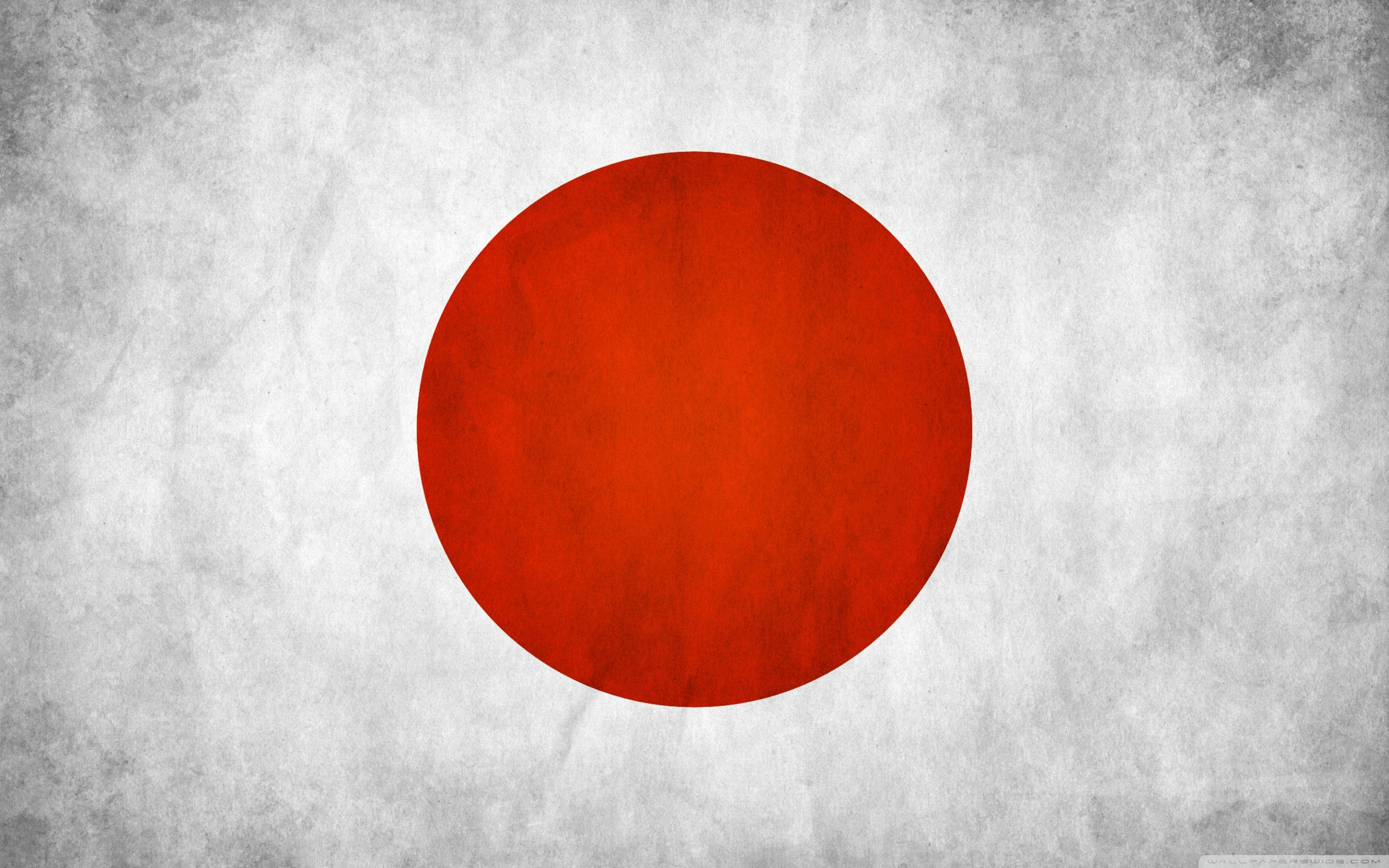 日本國旗灰調場景 壁紙 — 紋理白色背景中央有一個大膽的紅色圓圈，喚起復古日本國旗的美學。