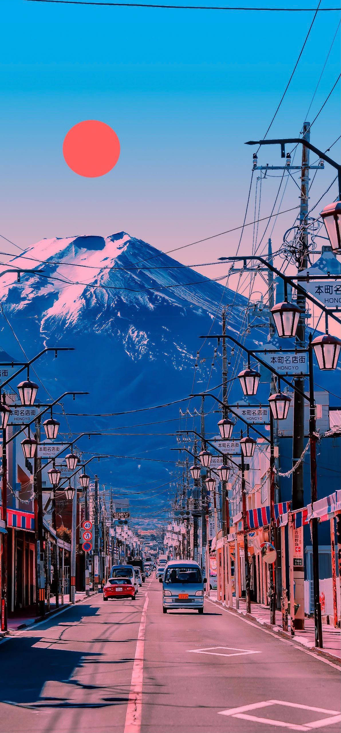 日本富士山懷舊風景 壁紙 — 一條充滿活力的日本街道，在風格化的紅日下通往積雪的富士山。