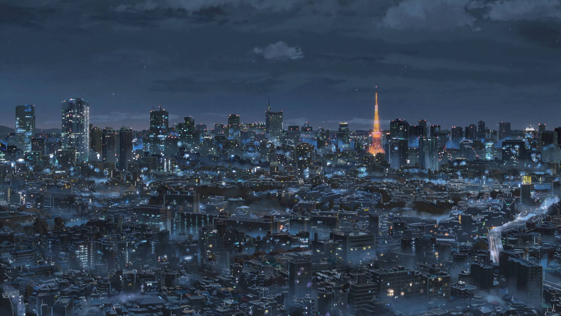 東京日本4K夜景 壁紙 — 夜晚東京廣闊嘅天際線，閃爍嘅摩天大樓同標誌性嘅東京塔喺黑暗多雲嘅天空下照亮。