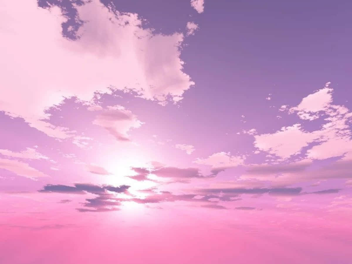 Pink Sky 桌布 壁紙 — 日落時分夢幻的粉紅與紫色天空，柔軟的雲朵圍繞著明亮的太陽發光。