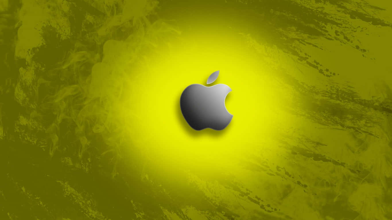 明亮多彩蘋果標誌於深藍背景 壁紙 — 一個時尚的銀色Apple標誌，居中於充滿活力的黃綠色紋理背景上，帶有徑向光暈。