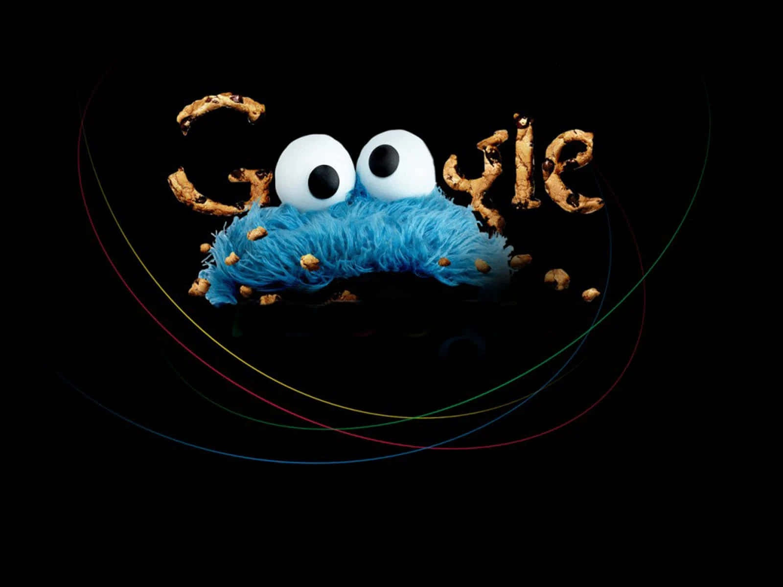 明亮插畫風格的 Google 標誌 壁紙 — Cookie Monster 從 Google 標誌中出現，帶有朱古力曲奇碎屑，背景為黑色並有彩色弧線。