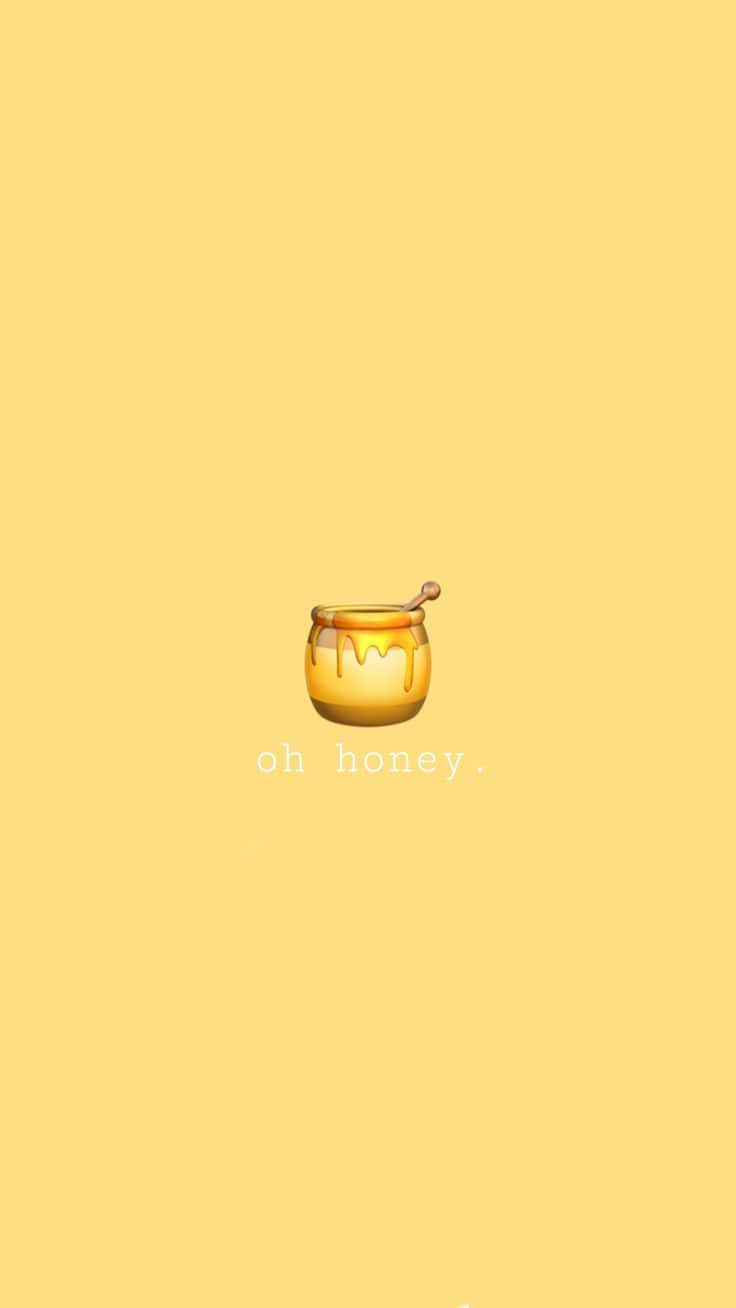 一個蜂蜜罐表情符號，滴著蜂蜜，在黃色背景上有文字 oh honey。