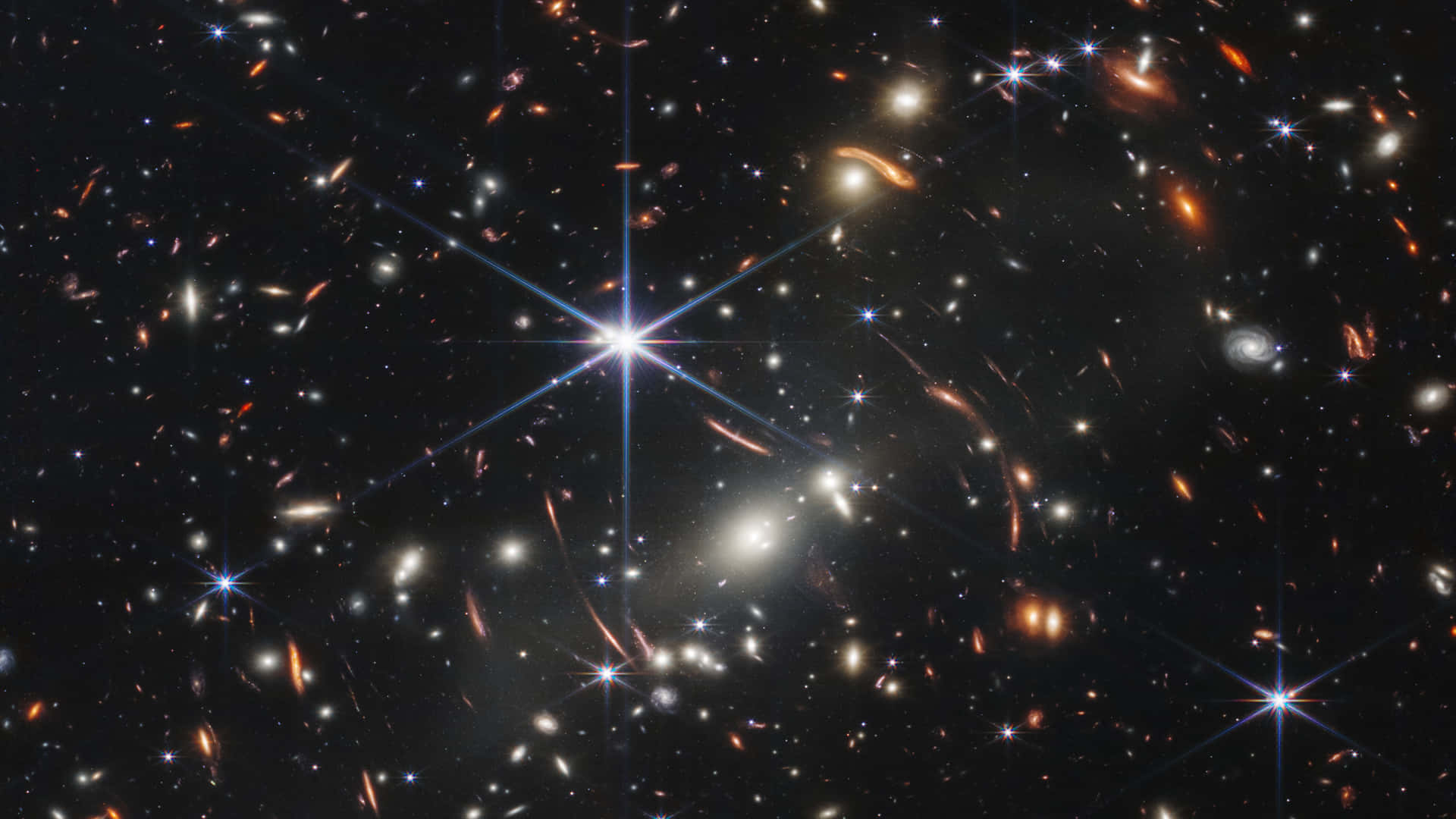 星光天文圖像 壁紙 — 令人嘆為觀止的宇宙景觀，充滿了發光的星系和燦爛的星星，背景是深邃的黑色虛空。