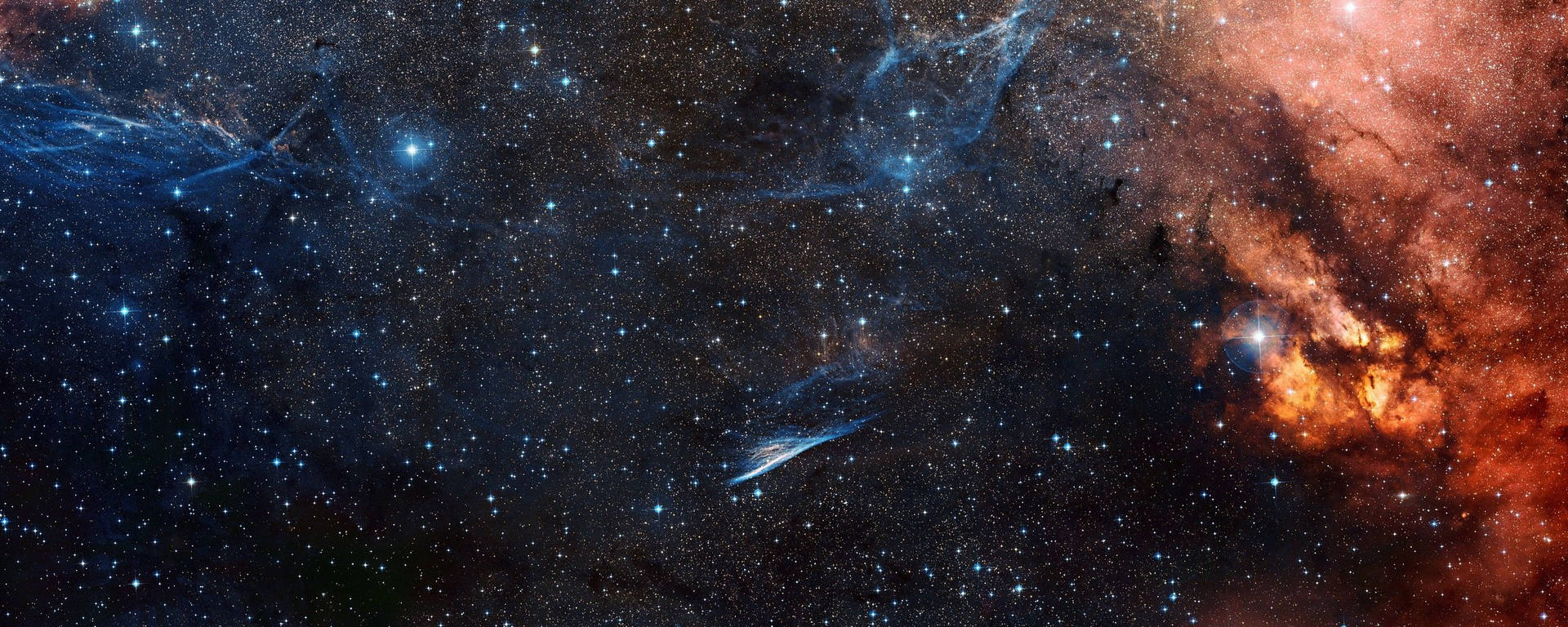 深邃太空中 vibrant 的宇宙星雲和星辰，帶有藍色和橙色色調。