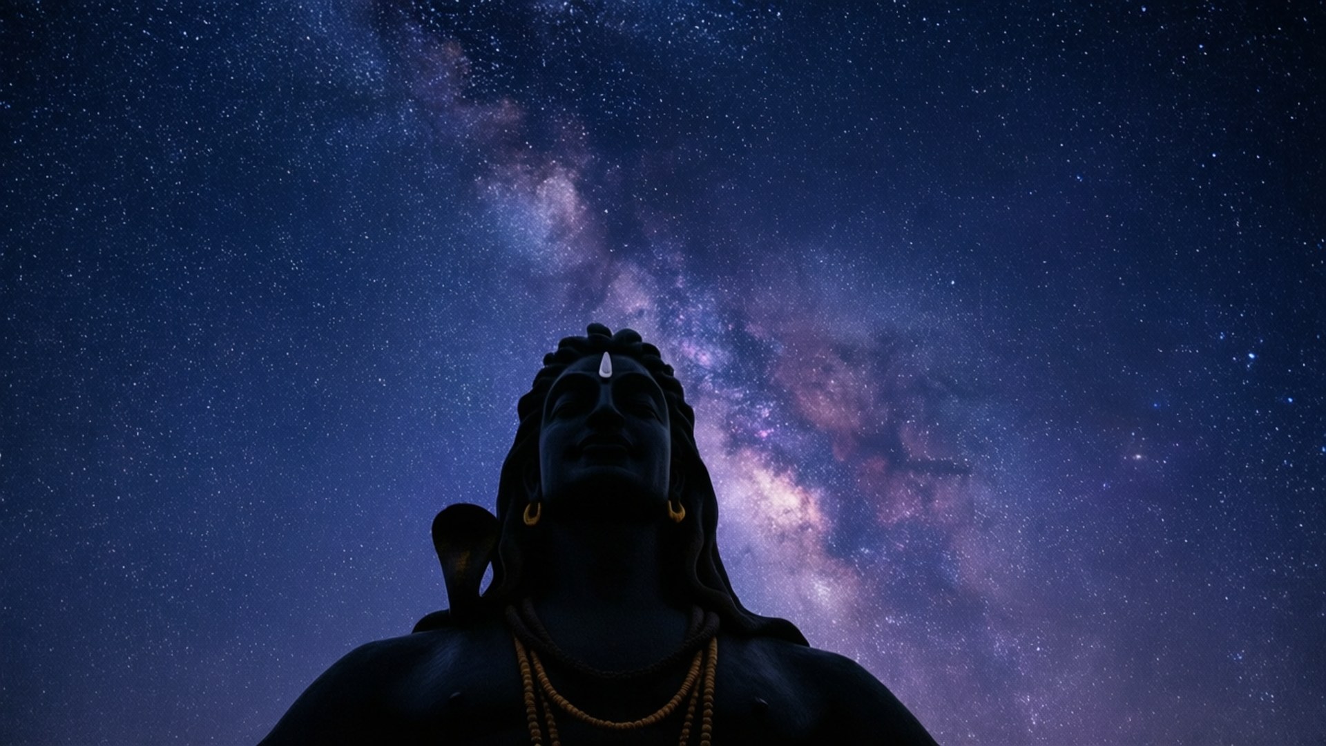 星夜阿迪瑜伽 壁紙 — 神聖雕像的剪影仰望閃耀著宇宙紫色和藍色色調的 vibrant 銀河系。