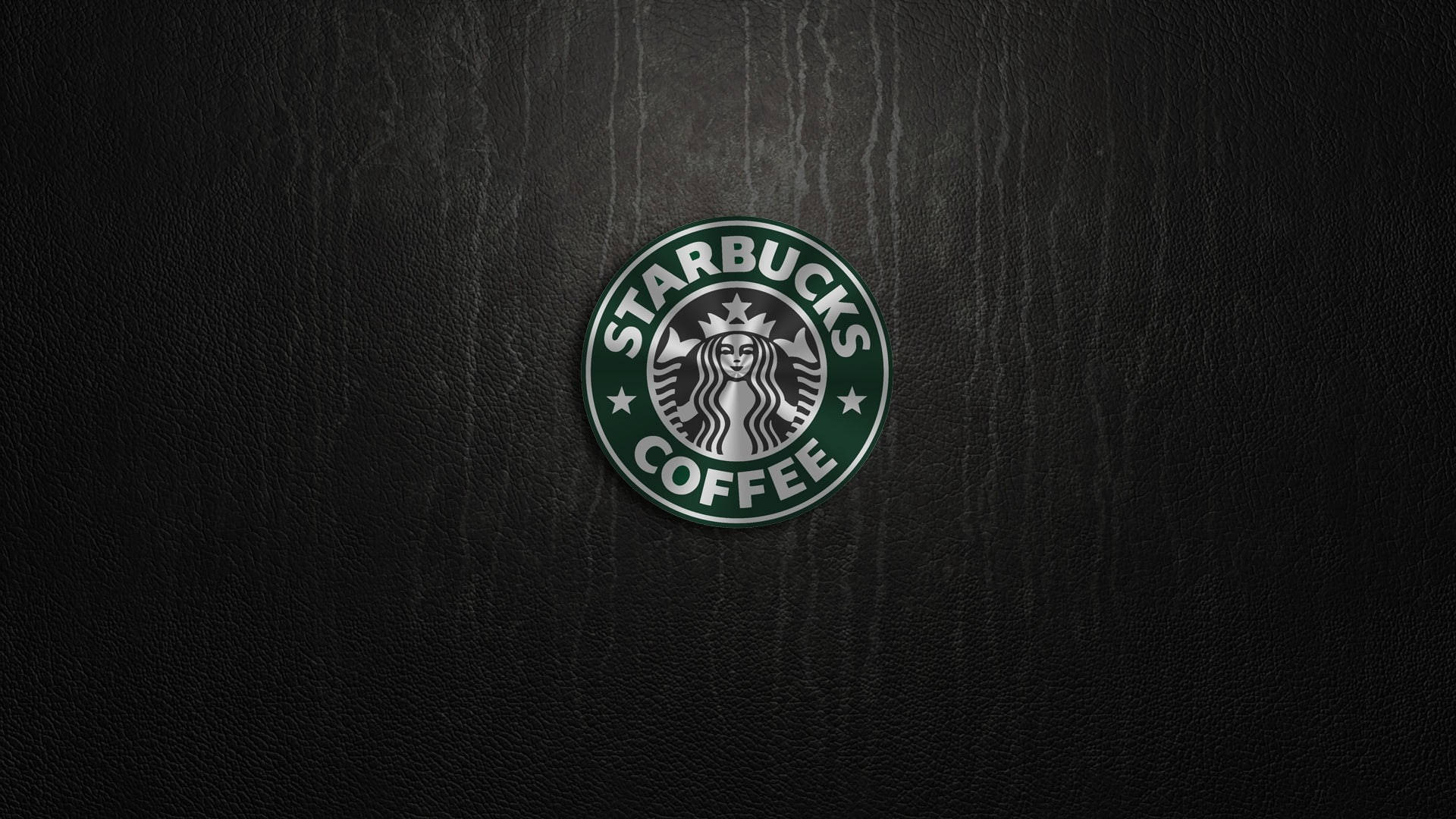 深色皮革紋理上的Starbucks咖啡標誌。 — 星巴克 壁紙