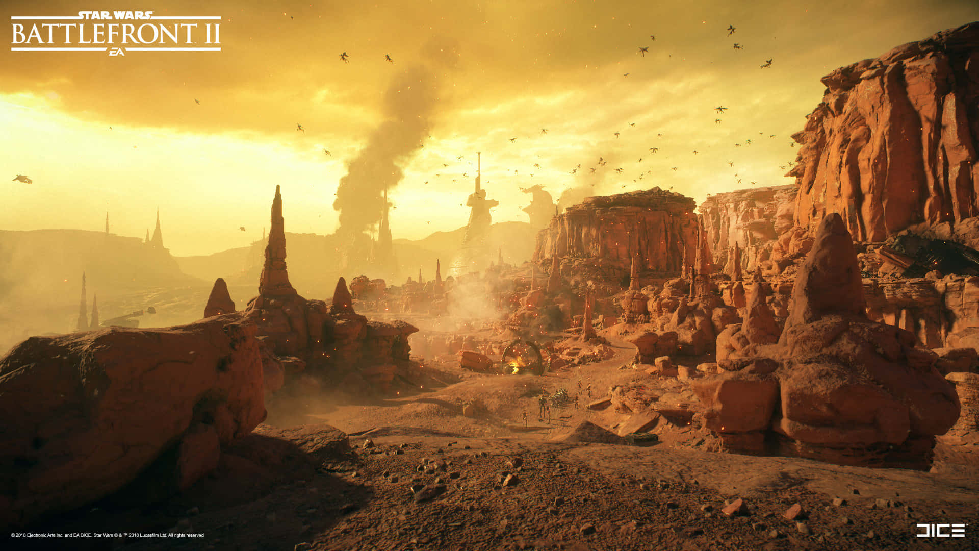 The Battle Of Geonosis 桌布 壁紙 — 《星球大戰：前線II》中，夕陽下的沙漠戰場，高聳的岩石構造、升起的煙霧和飛越頭頂的星際戰機。