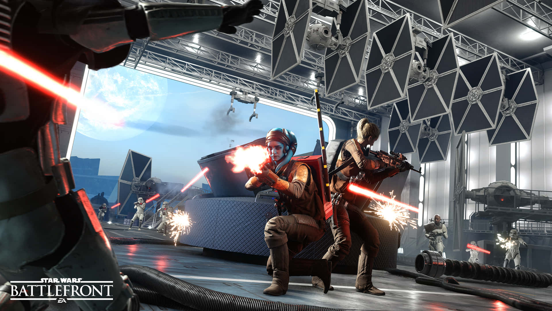 The Battle Of Jakku 桌布 壁紙 — 星球大戰叛軍在一個高科技機庫中發射爆能槍，頭頂懸掛著TIE戰鬥機。