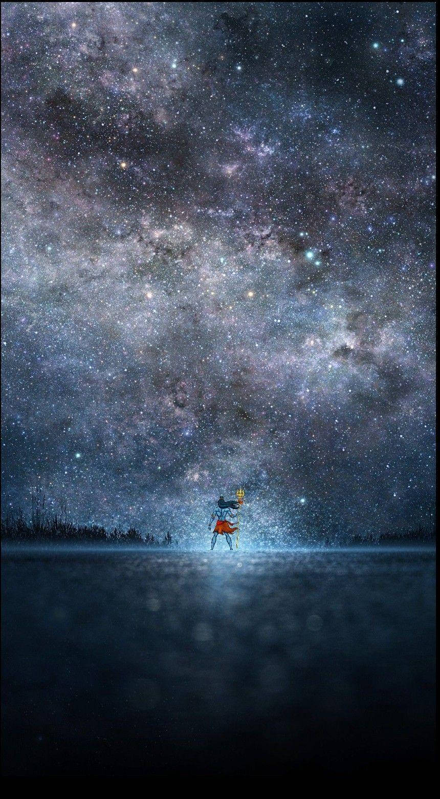 一個人獨自站在冰凍的湖面上，頭頂是令人嘆為觀止的星空。