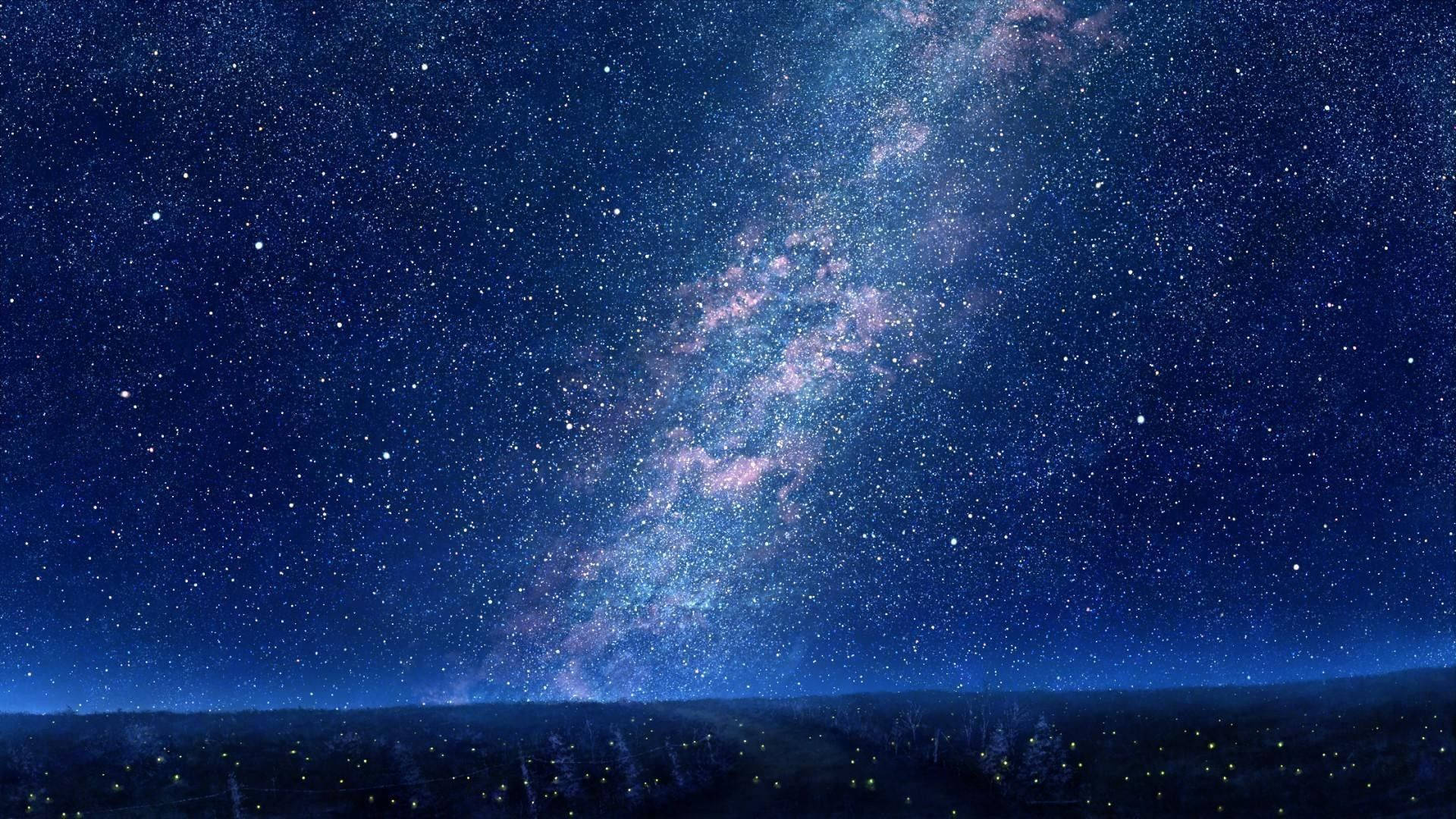 銀河系在繁星點點的夜空下，在黑暗的地平線上方閃耀。