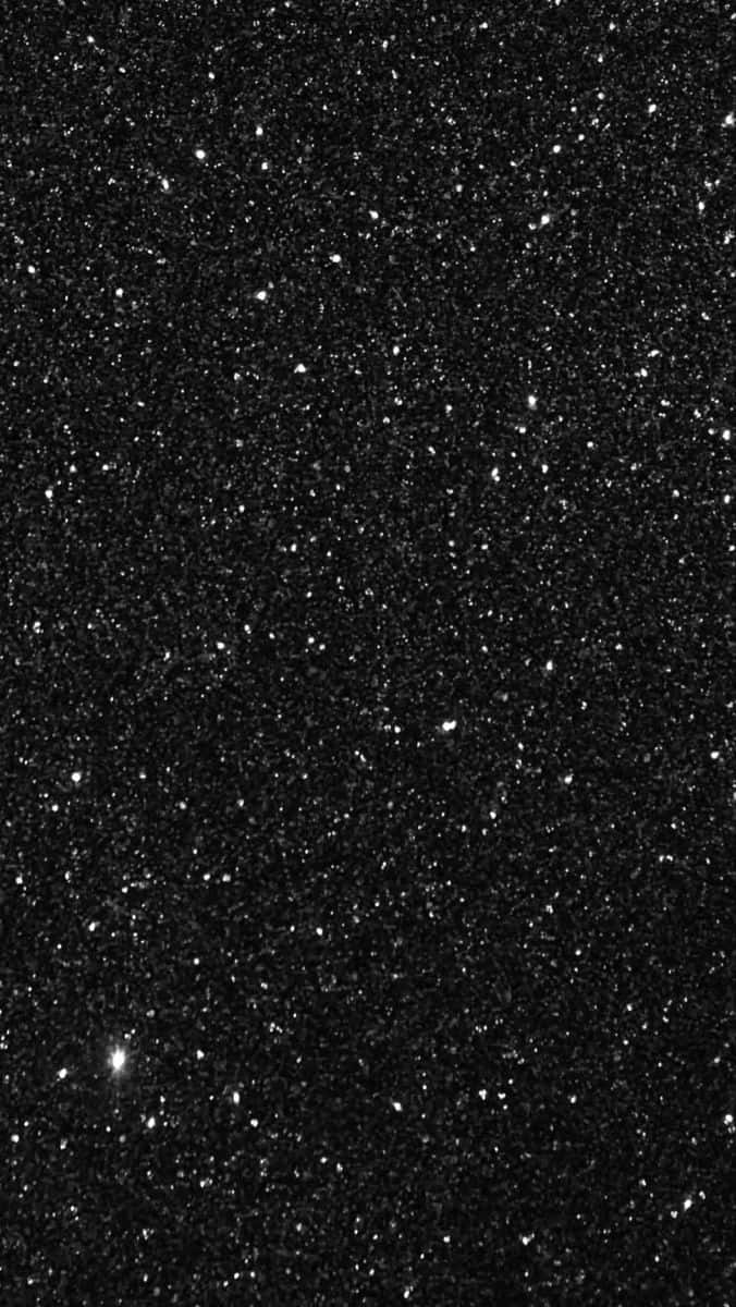 黑色背景覆蓋白色閃粉顆粒，營造閃爍效果。