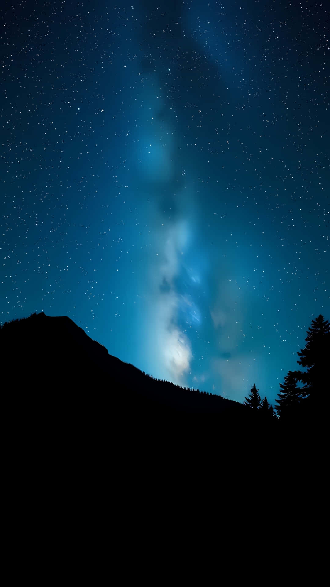 在星空和銀河下的山脈和樹木輪廓