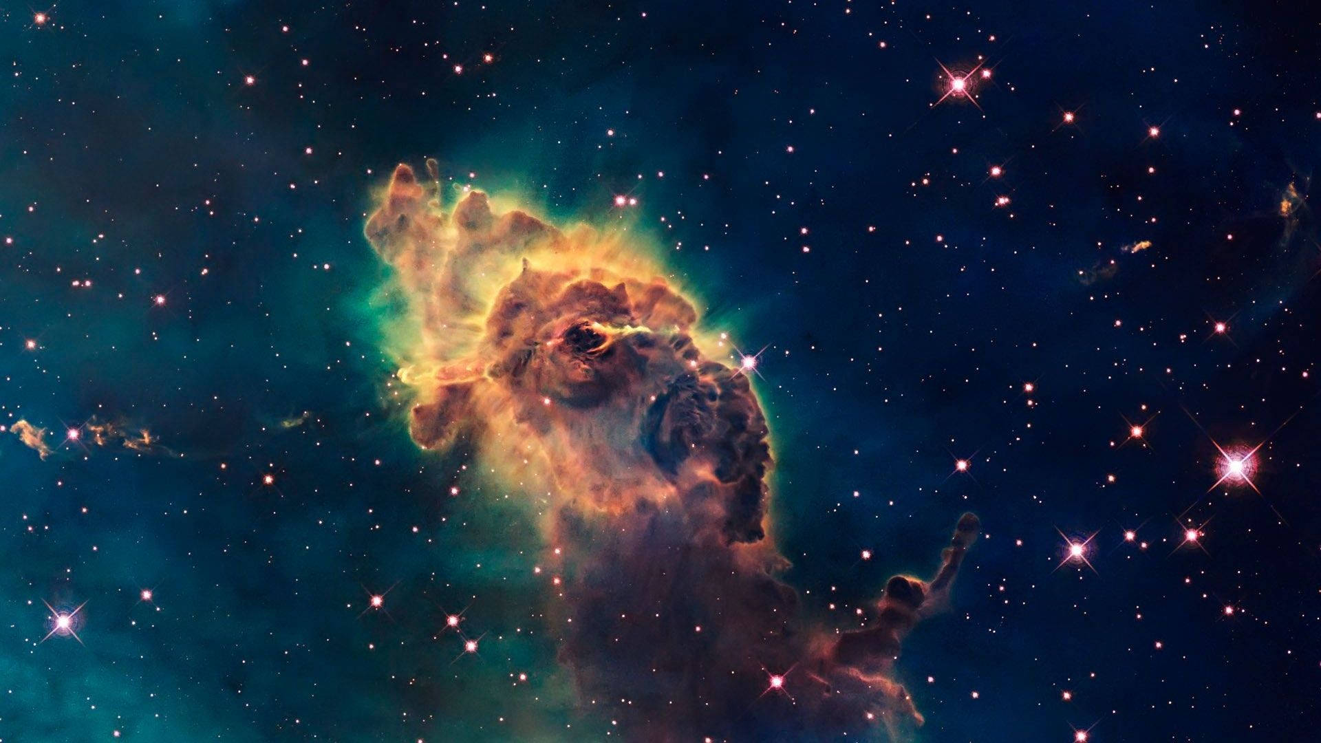 一個色彩繽紛的星雲，在深空中有發光的氣體雲和明亮的星星。