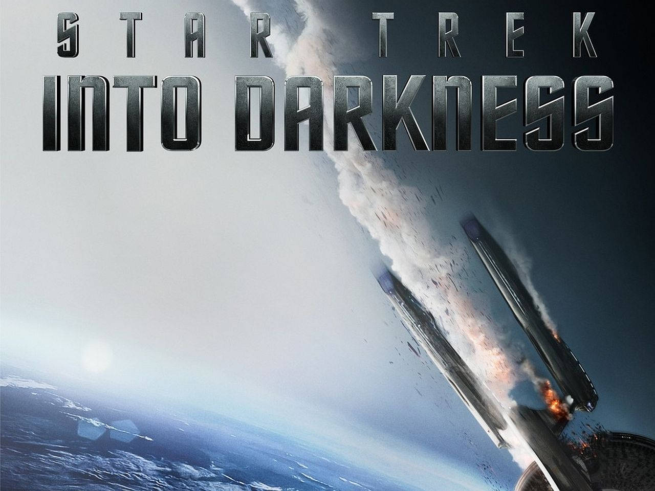 星際迷航：暗黑無垠太空船海報 壁紙 — 一艘星艦在藍色星球上空爆炸成熾熱碎片，標題《Star Trek Into Darkness》懸掛在上方。