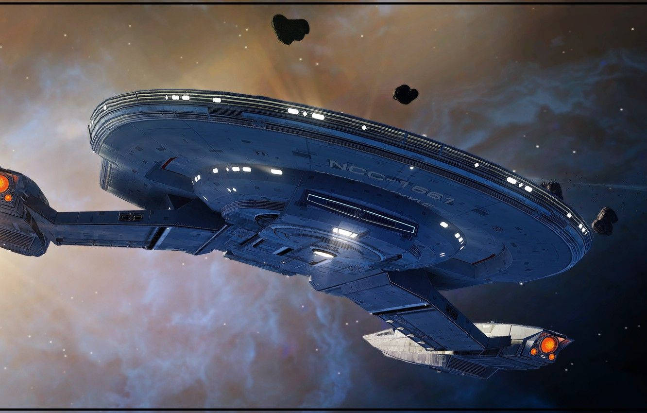星際迷航克拉克號星艦底部視角 壁紙 — 一艘帶有NCC-1701標記的藍色星艦在色彩繽紛的星雲中滑行，周圍漂浮著小行星。
