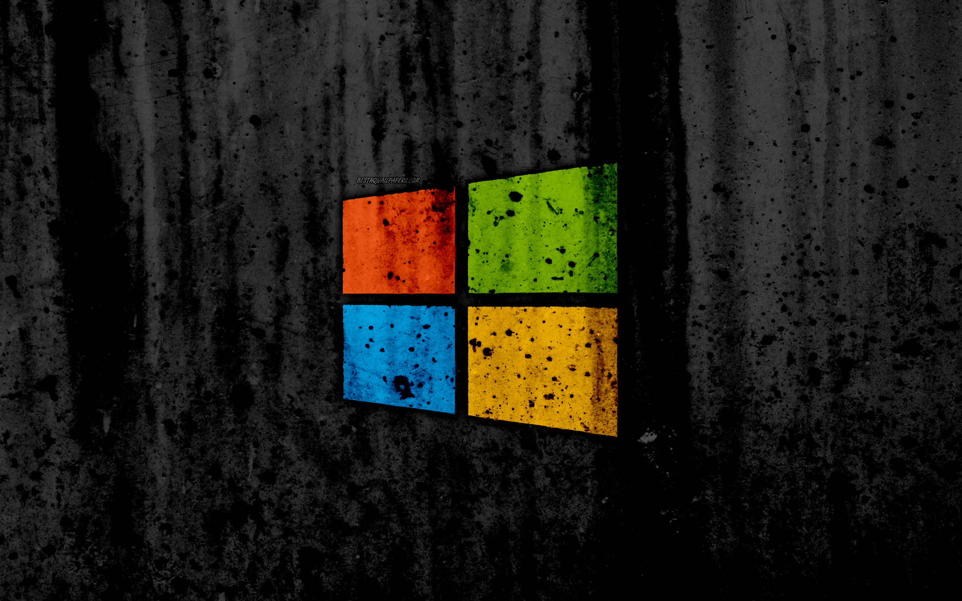 在深色紋理牆上的彩色方塊Microsoft標誌。