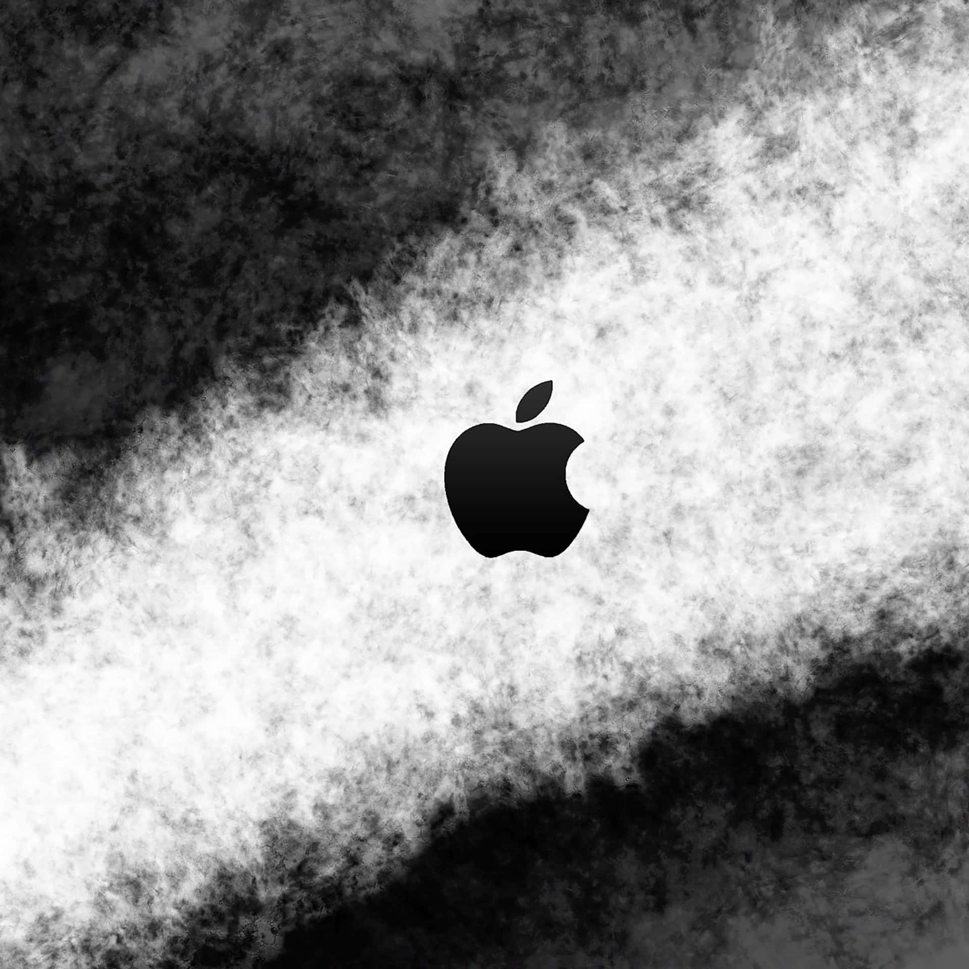 黑色Apple標誌在煙霧狀黑白抽象背景上