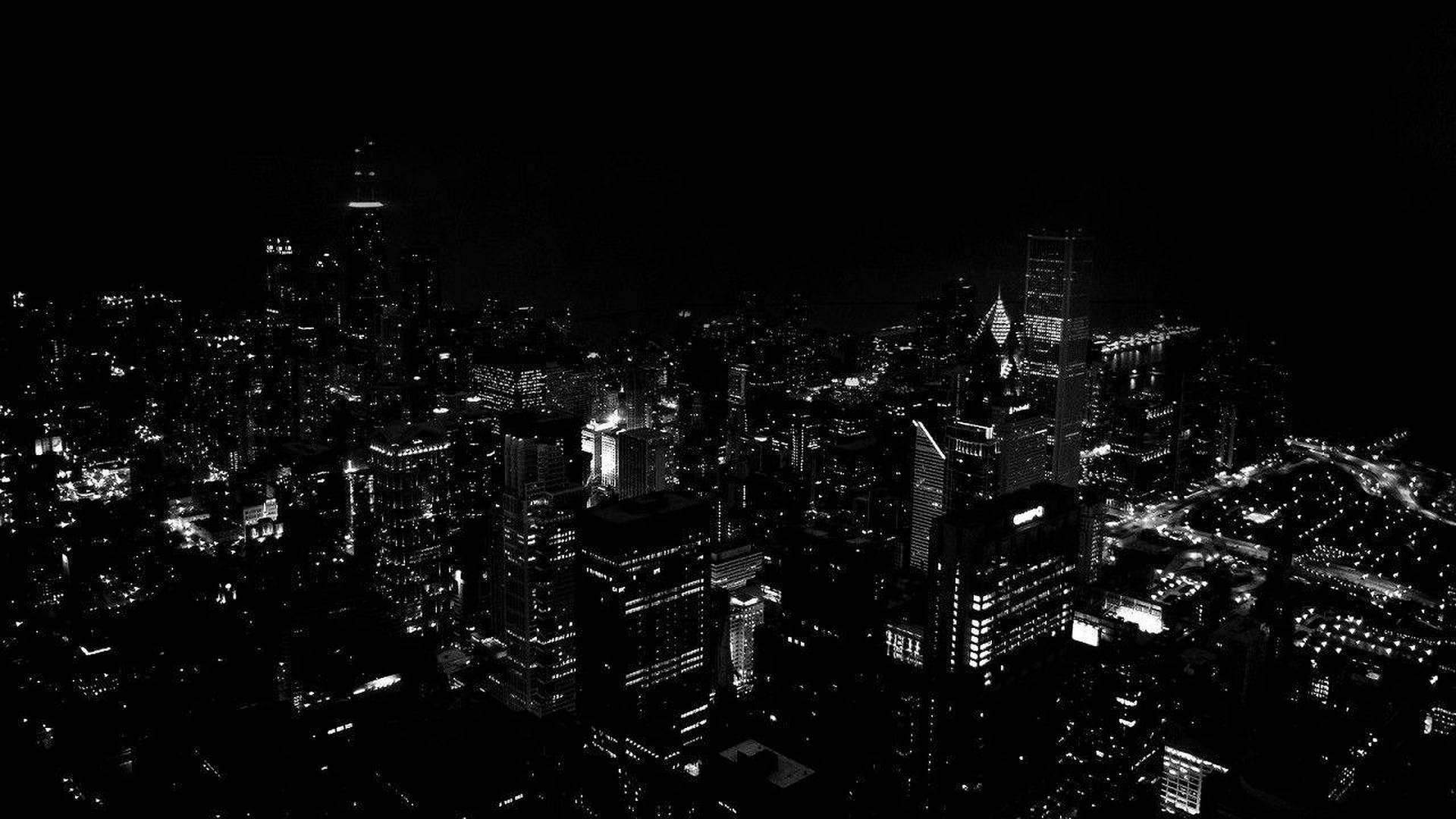城市夜晚的空中黑白照片，建築物閃閃發光。 — 暗夜城市 壁紙