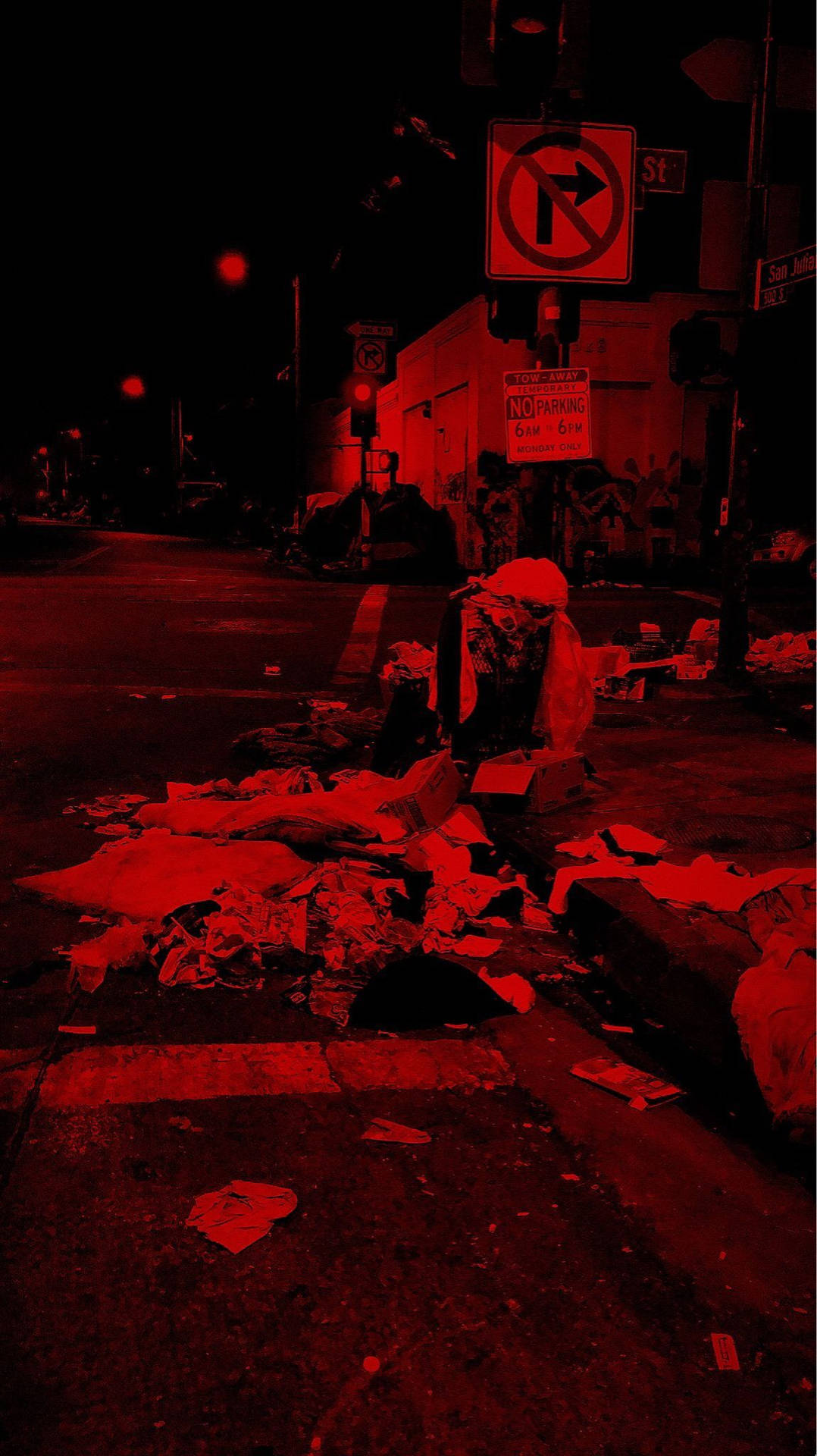 夜晚紅光照亮的街角，有垃圾和交通標誌。 — 深紅色動圖 壁紙