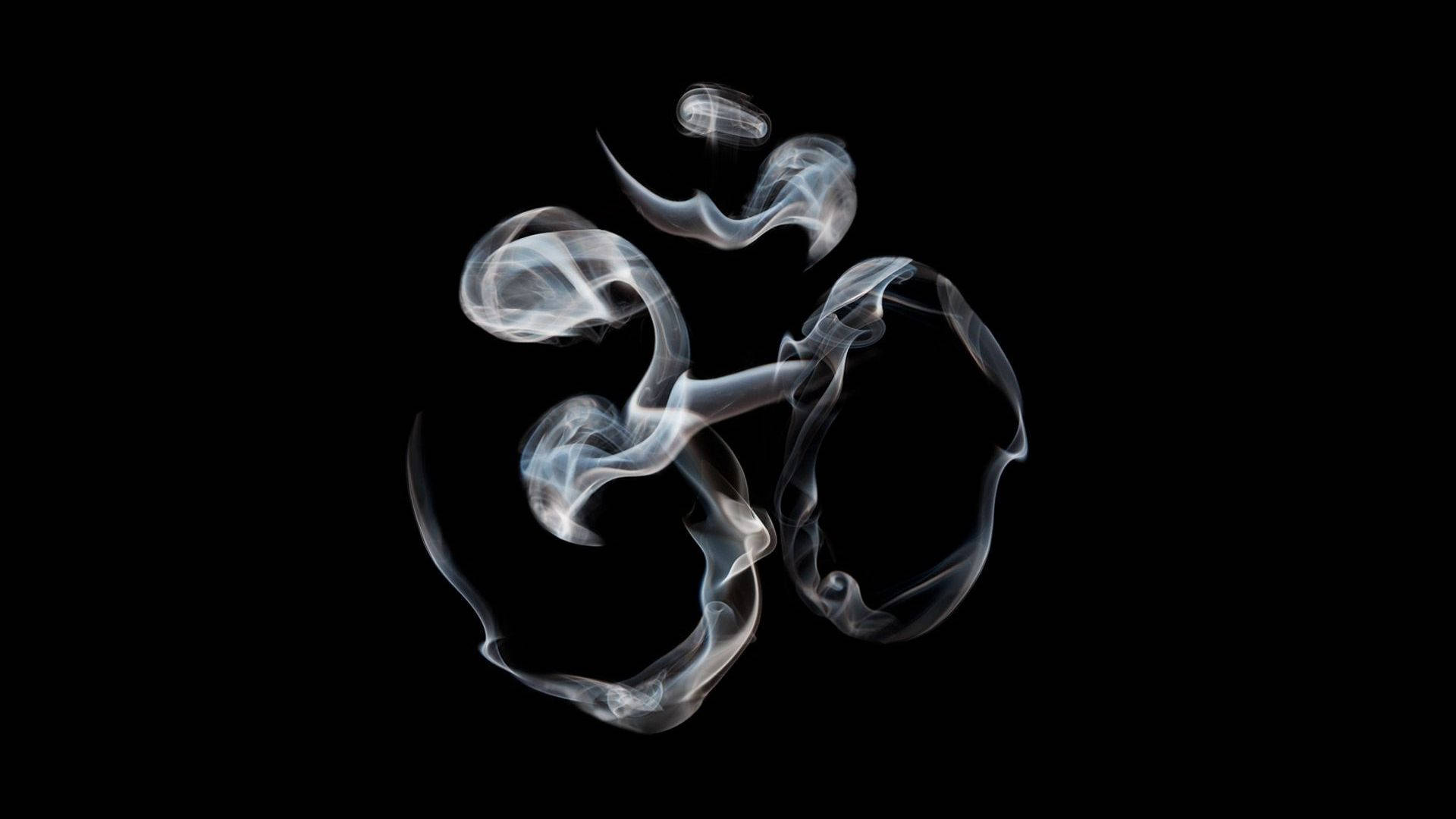 煙霧在黑色背景上形成「唵」符號