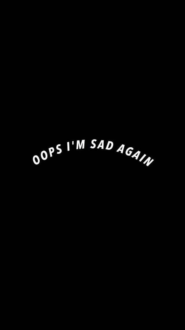 彎曲的白色文字在黑色背景上寫著 oops i'm sad again