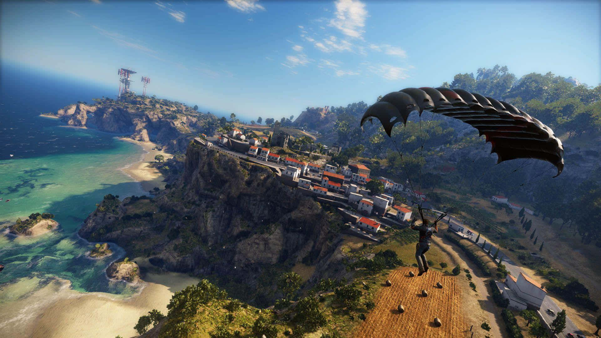 最佳Just Cause 4背景：里科傘降島嶼 壁紙 — 一名跳傘者在一片湛藍天空下，降落在一個擁有碧綠海水、沙灘和懸崖的海岸村莊上空。