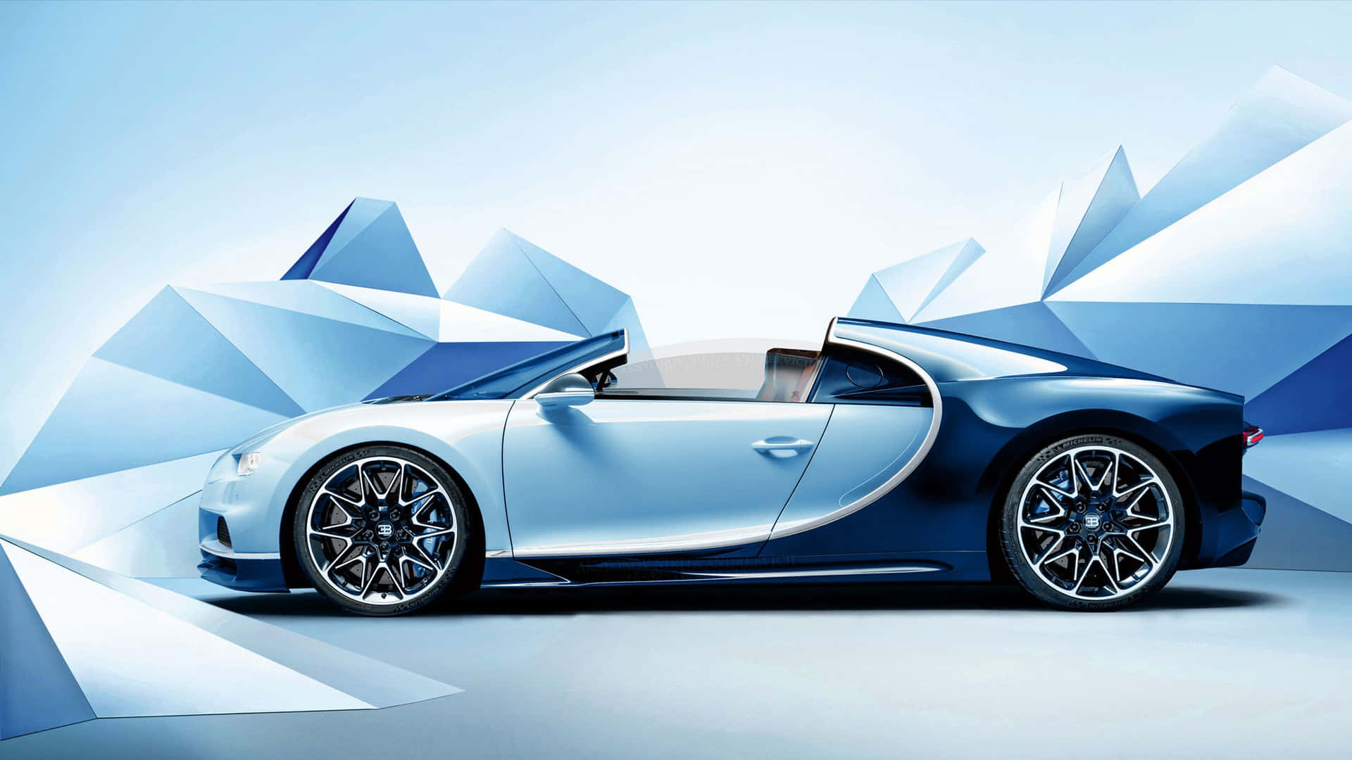 藍色 Bugatti 開篷跑車，配以幾何山景背景。