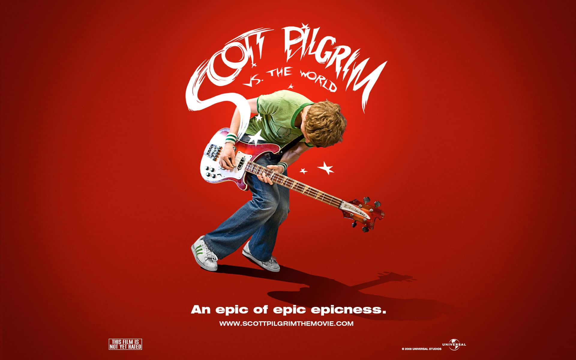 Scott Pilgrim 在動畫風格電影海報中彈奏低音結他。