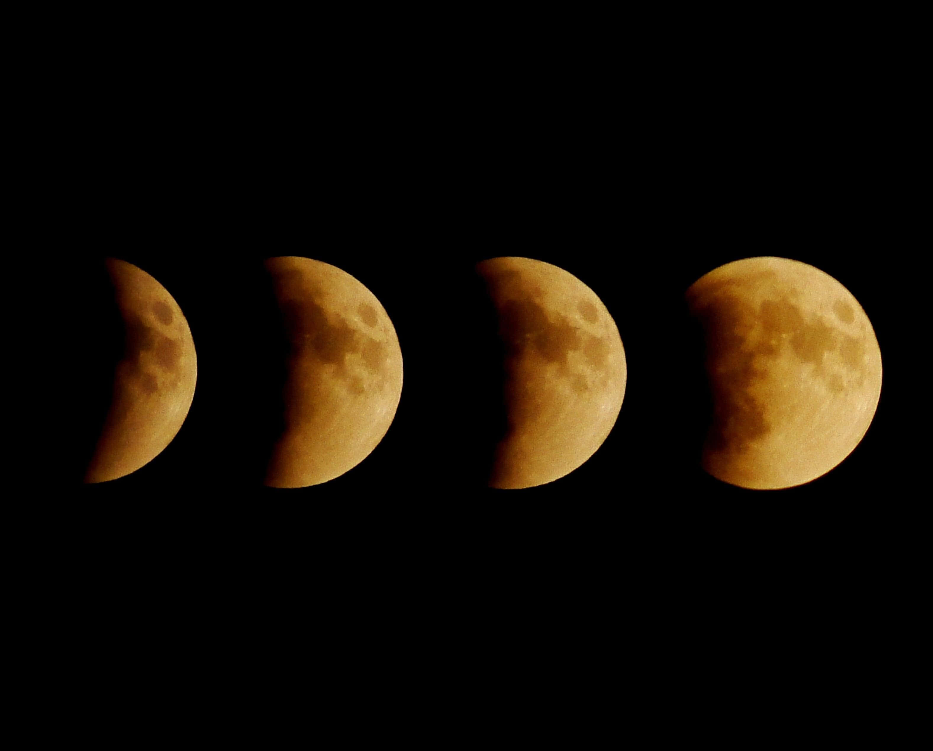 Moon Phases 桌布 壁紙 — 月食的四個連續階段顯示月球在地球陰影掠過時變成銅紅色。