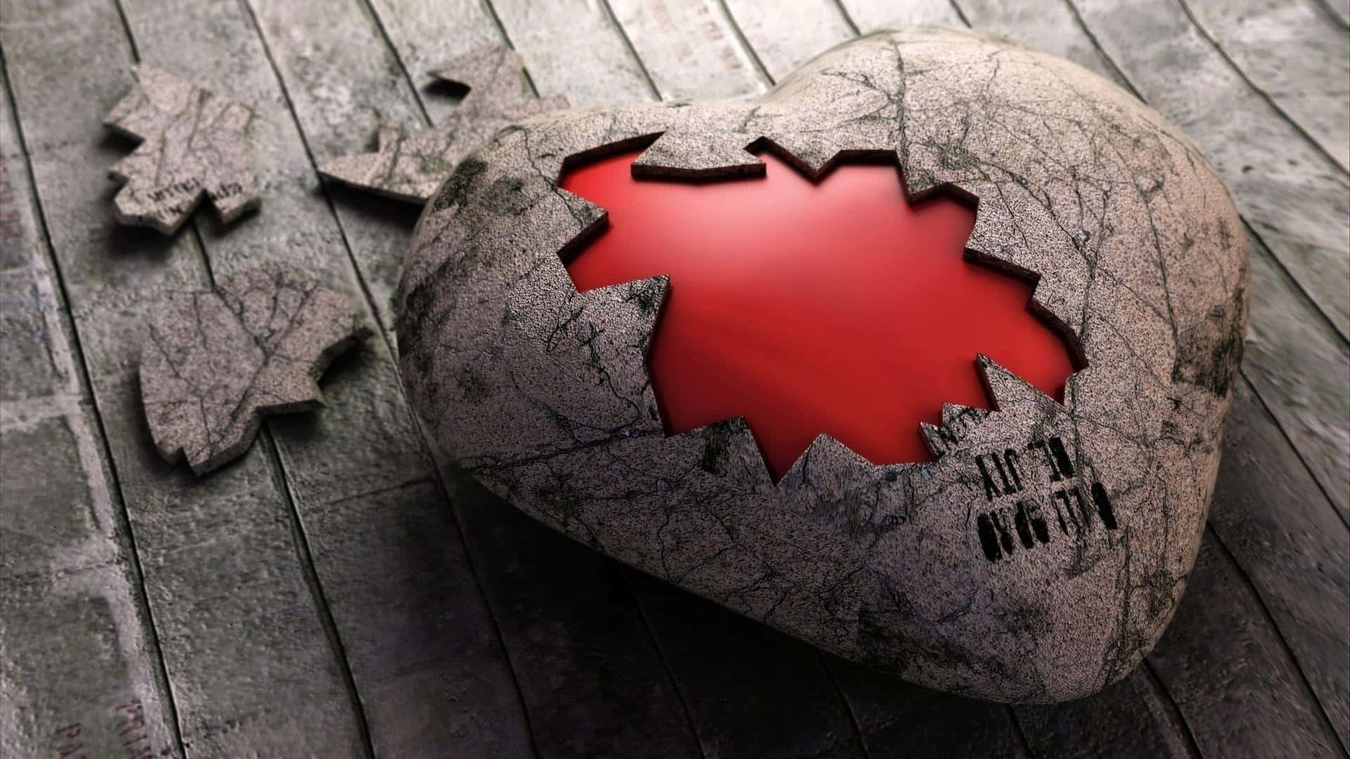 「有時我們必須經歷心碎，才能真正珍惜生活中的幸福。」 壁紙 — 一顆裂開的石心，邊緣參差不齊，露出鮮紅色的內部，擱在風化的木板上，附近散落著碎片。