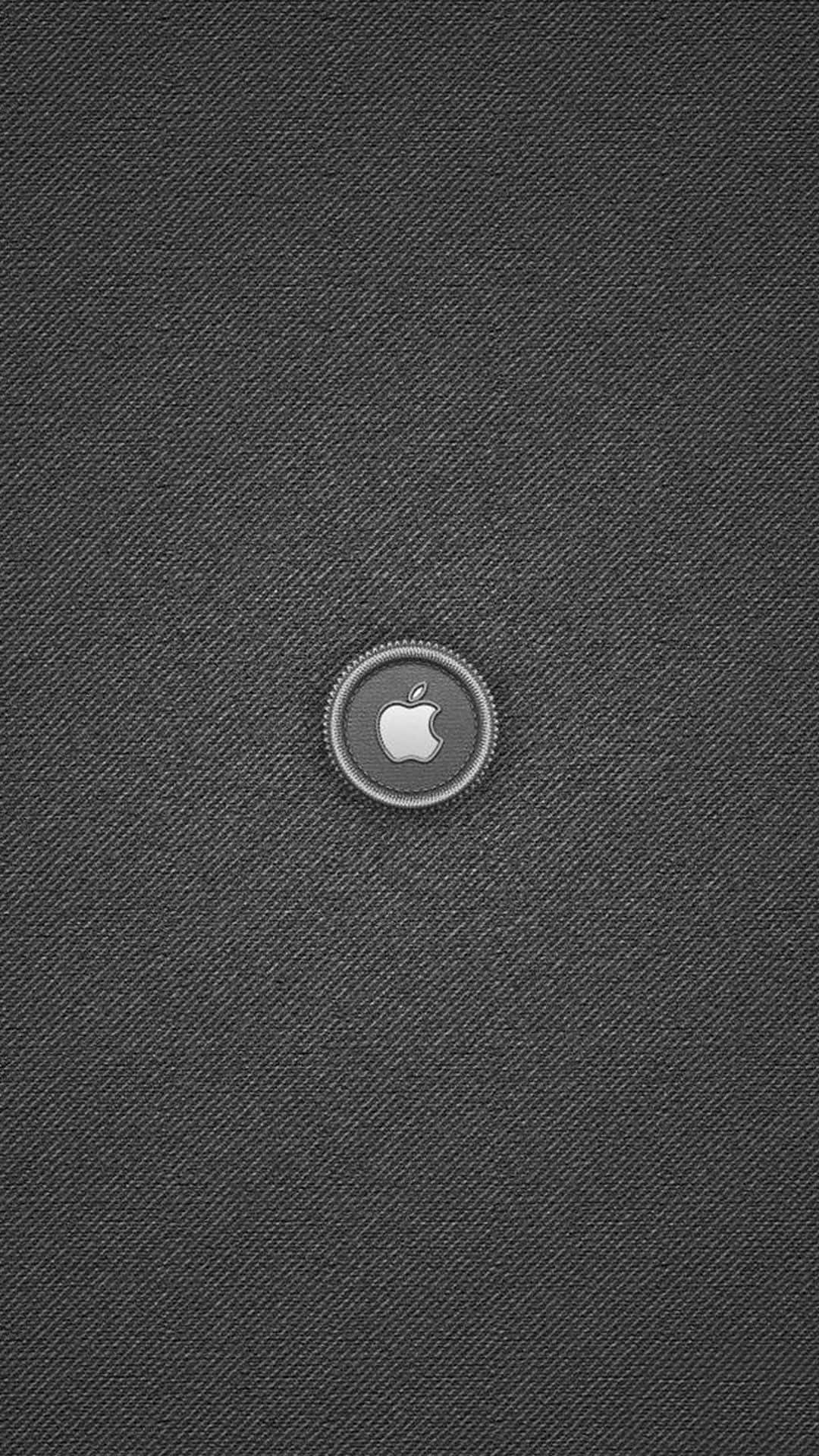 Apple標誌按鈕在帶有紋理的灰色布料背景上