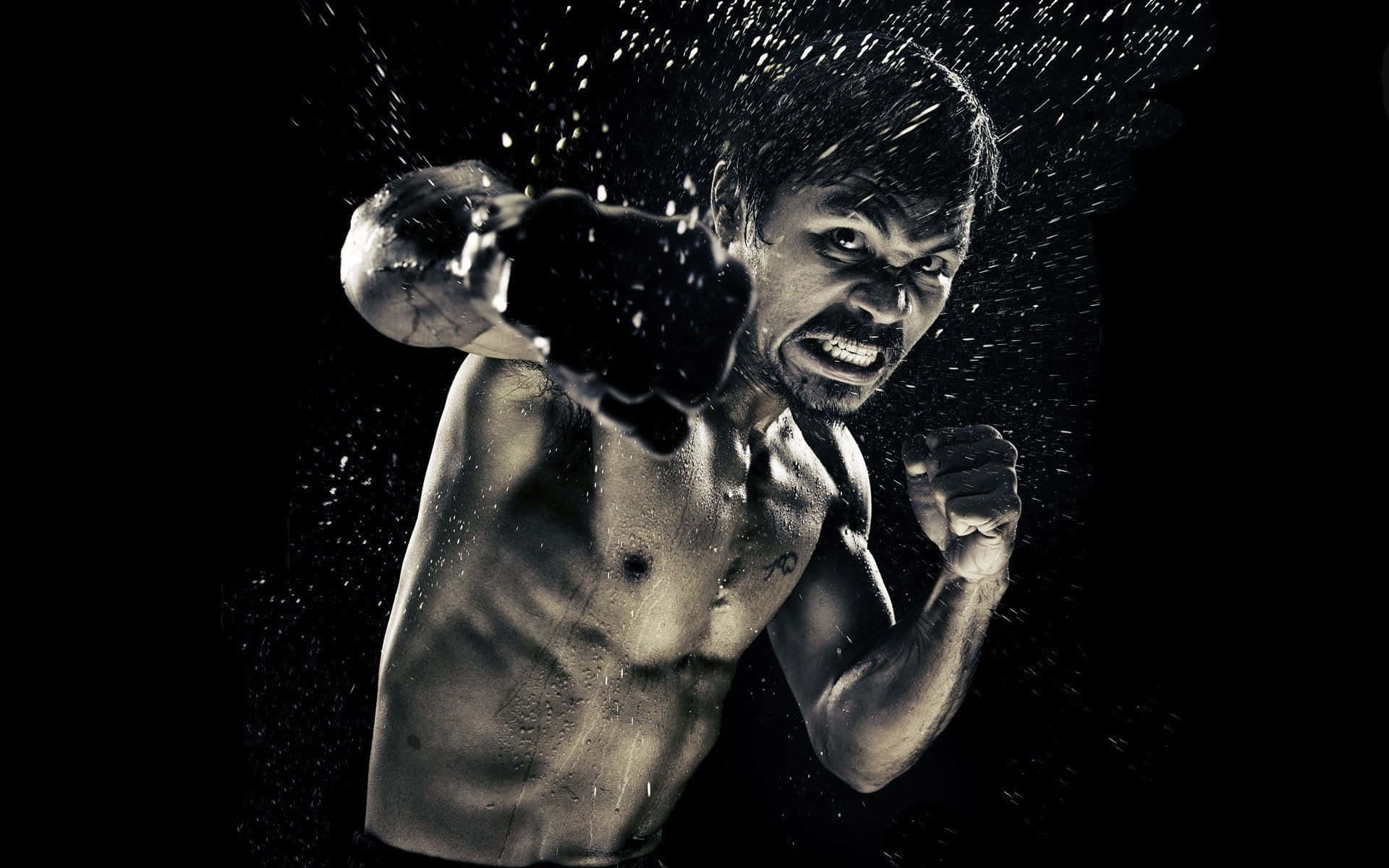 "朝勝利揮拳！" 壁紙 — 一個肌肉發達的拳擊手打出強力一拳，水花在黑色背景上戲劇性地飛濺。