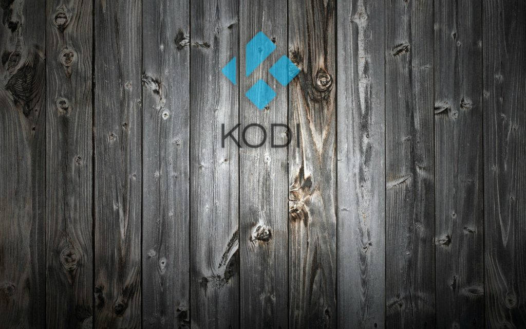 深色木質背景上的 Kodi 媒體播放器標誌