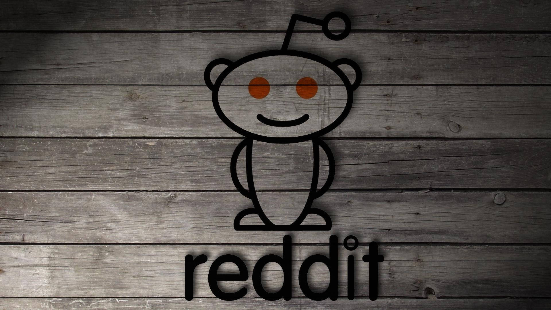 灰色木背景上的 Reddit 吉祥物標誌，下方有文字