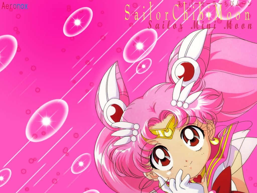 粉紅色頭髮和兔耳朵的Sailor Chibi Moon動漫角色，背景是閃爍的粉紅色。